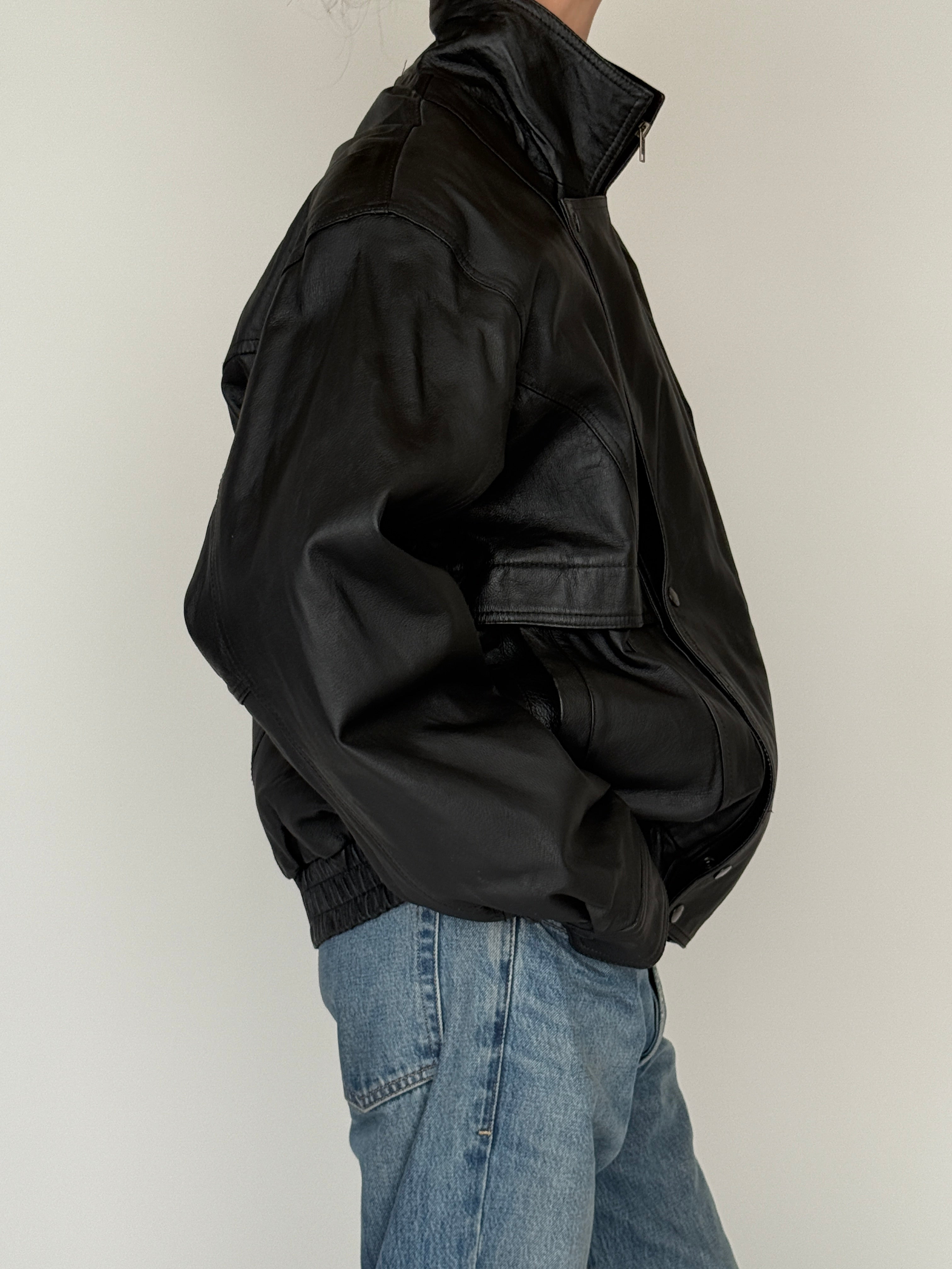 Vintage black leather jacket side view