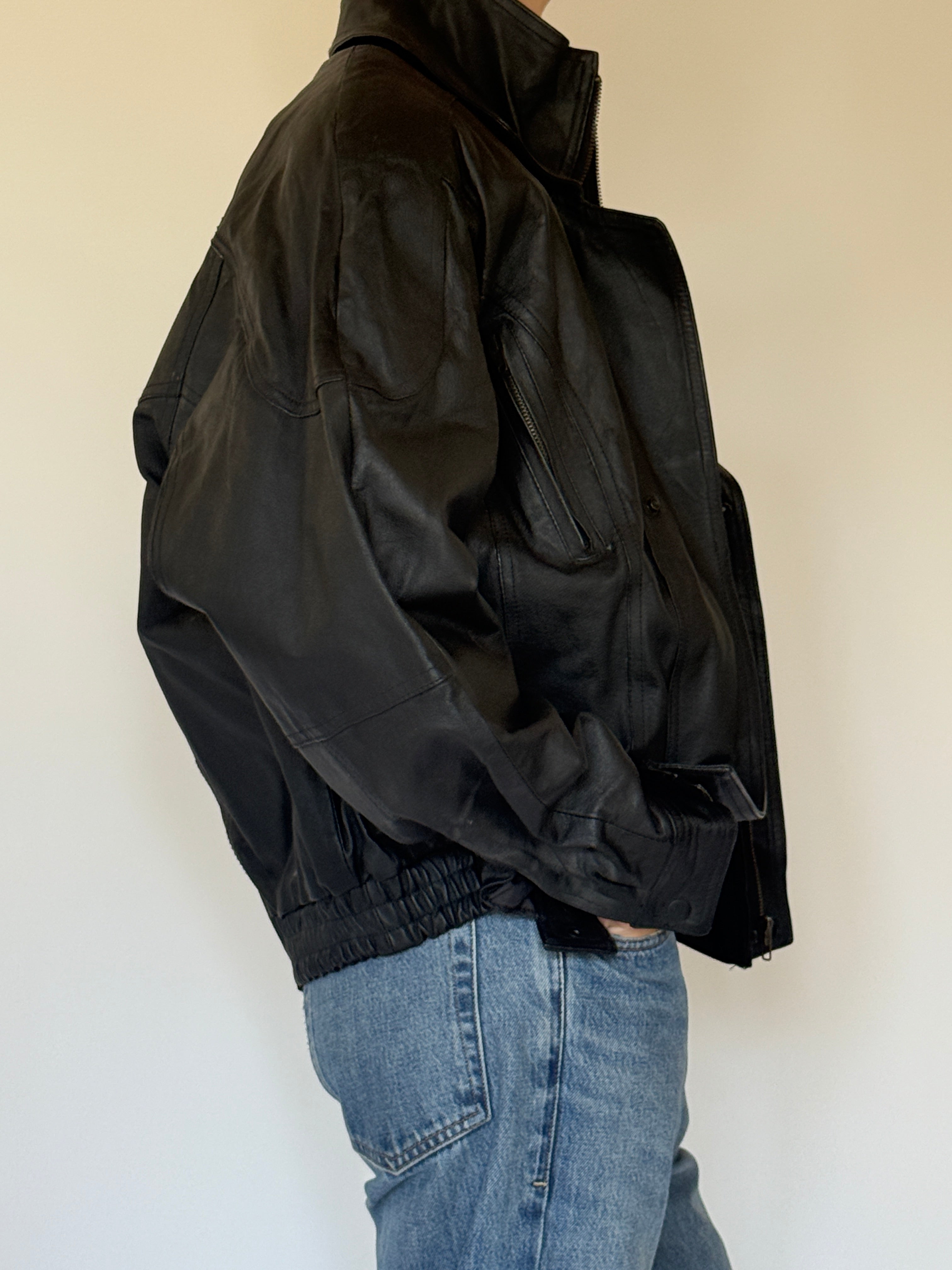 Vintage black leather jacket side view