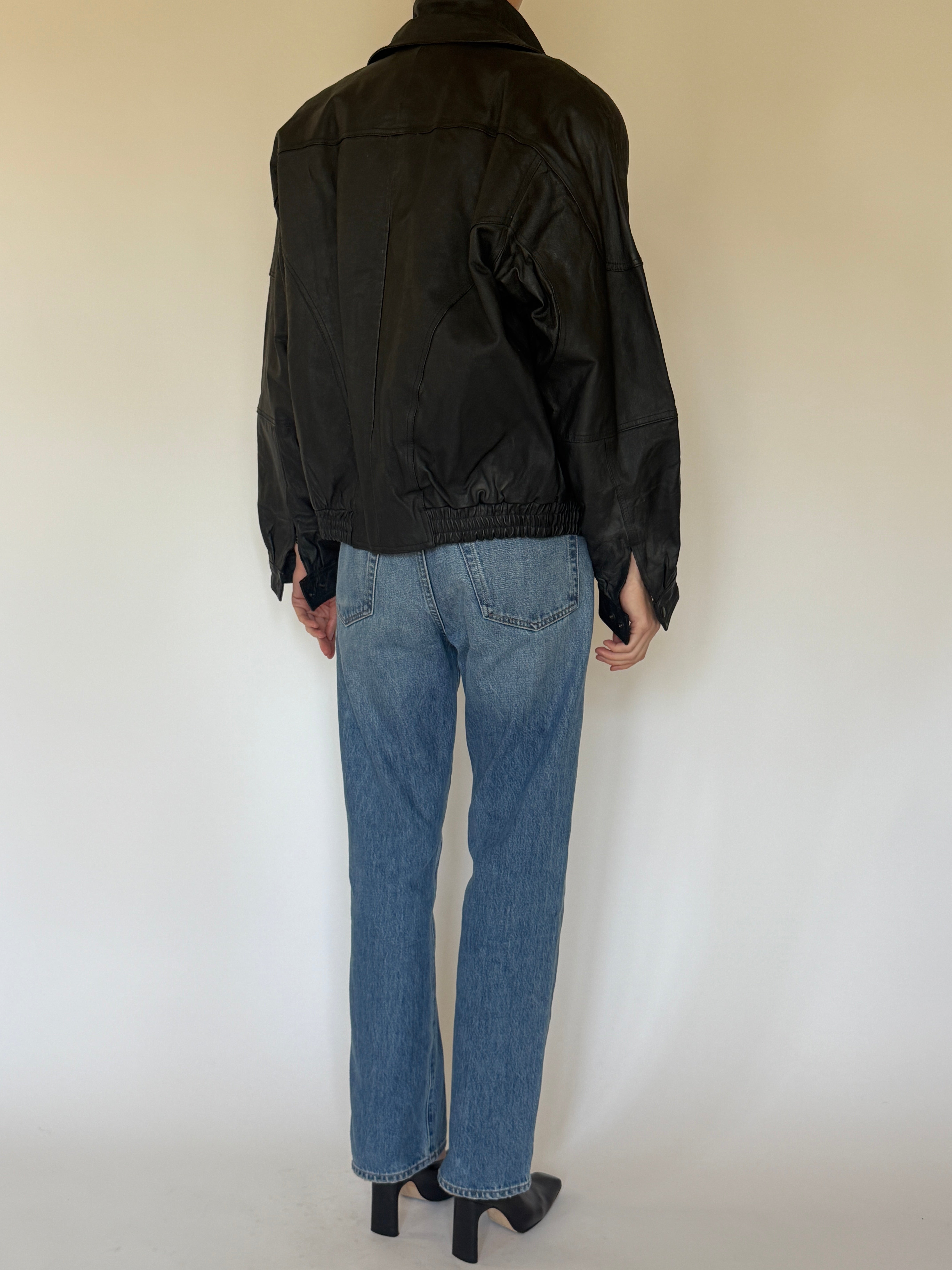 Vintage black leather jacket back view