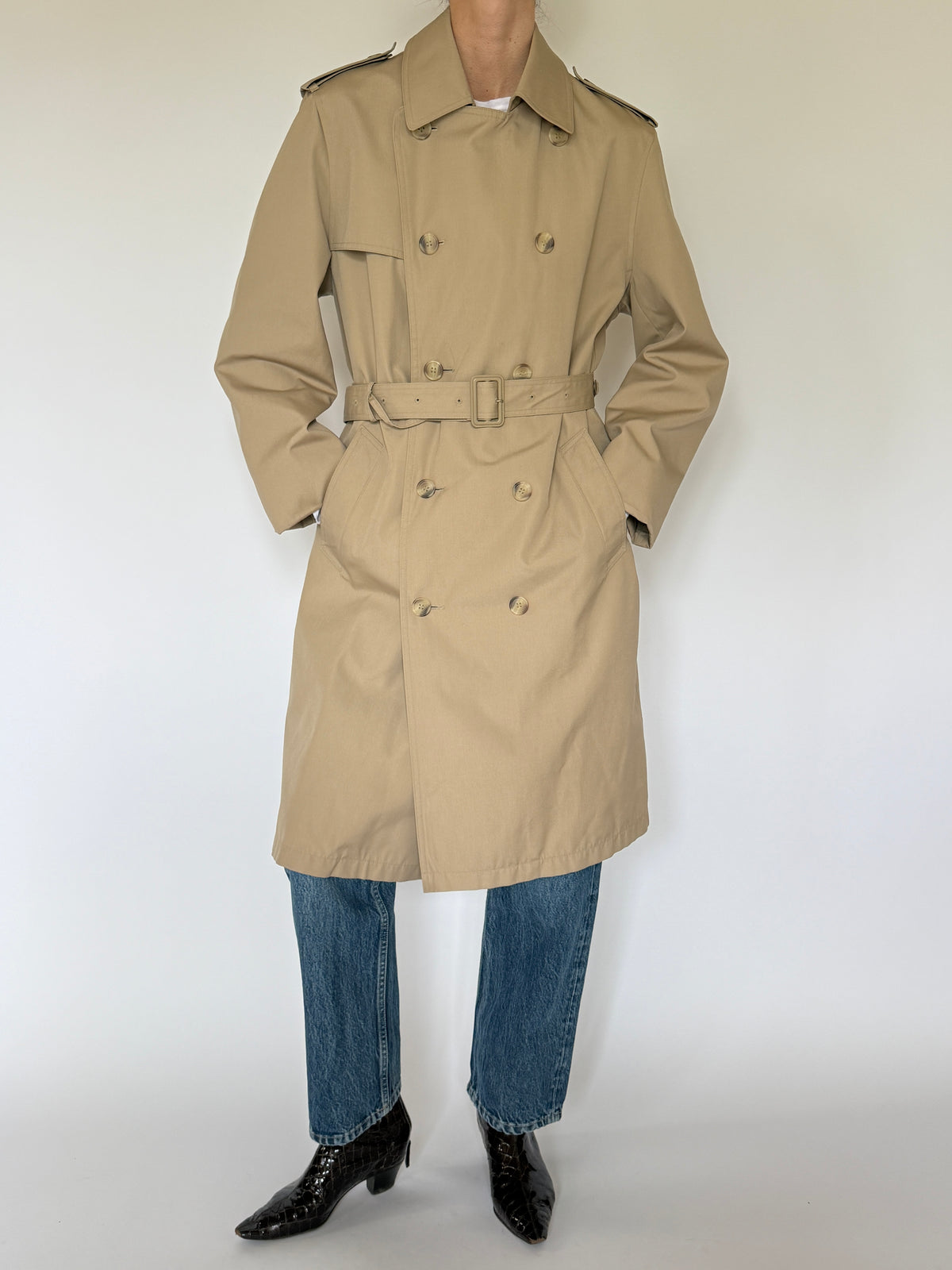 Vintage tan trench coat pocket detail with angled side pocket