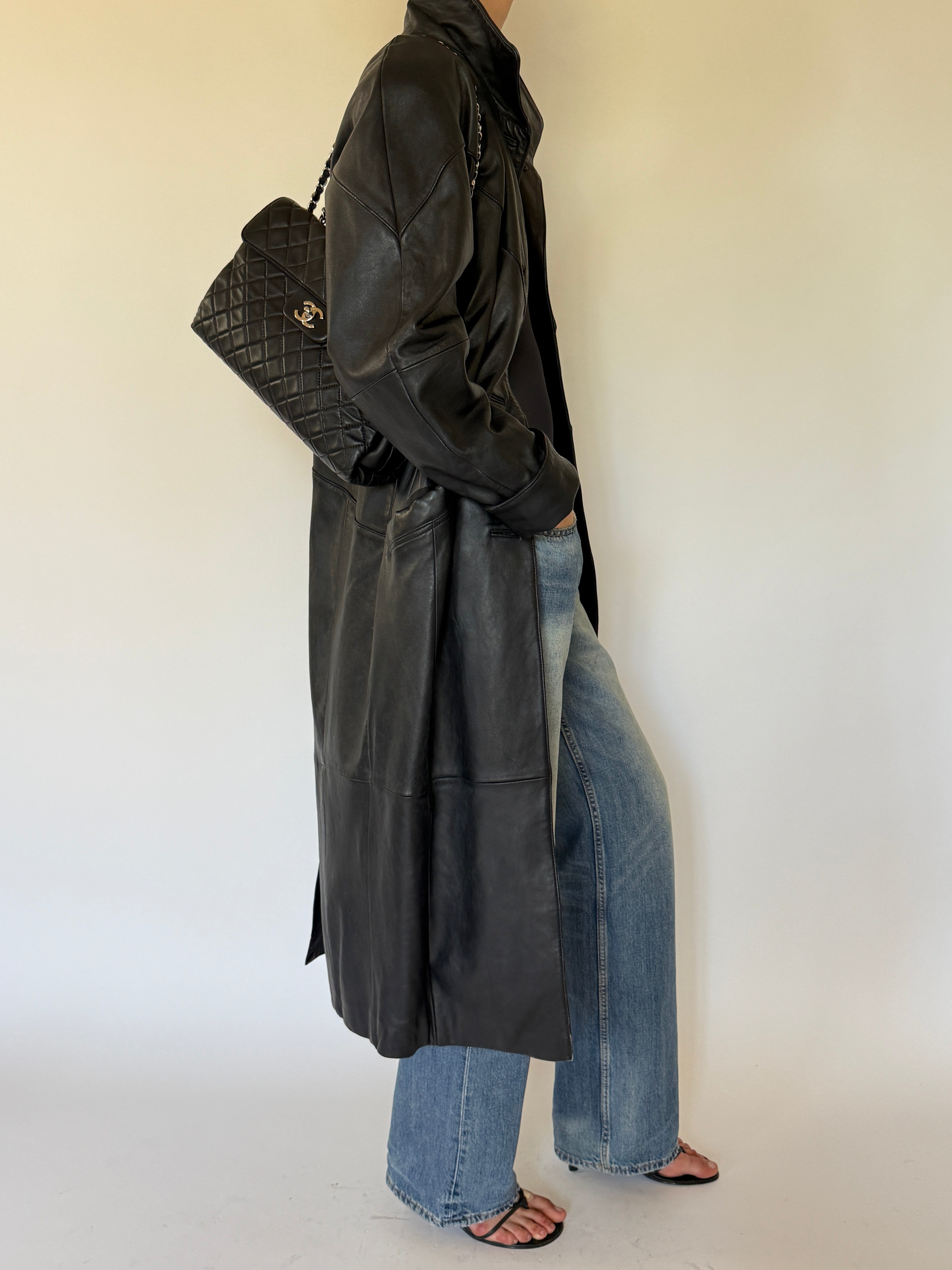 Vintage black leather coat side view