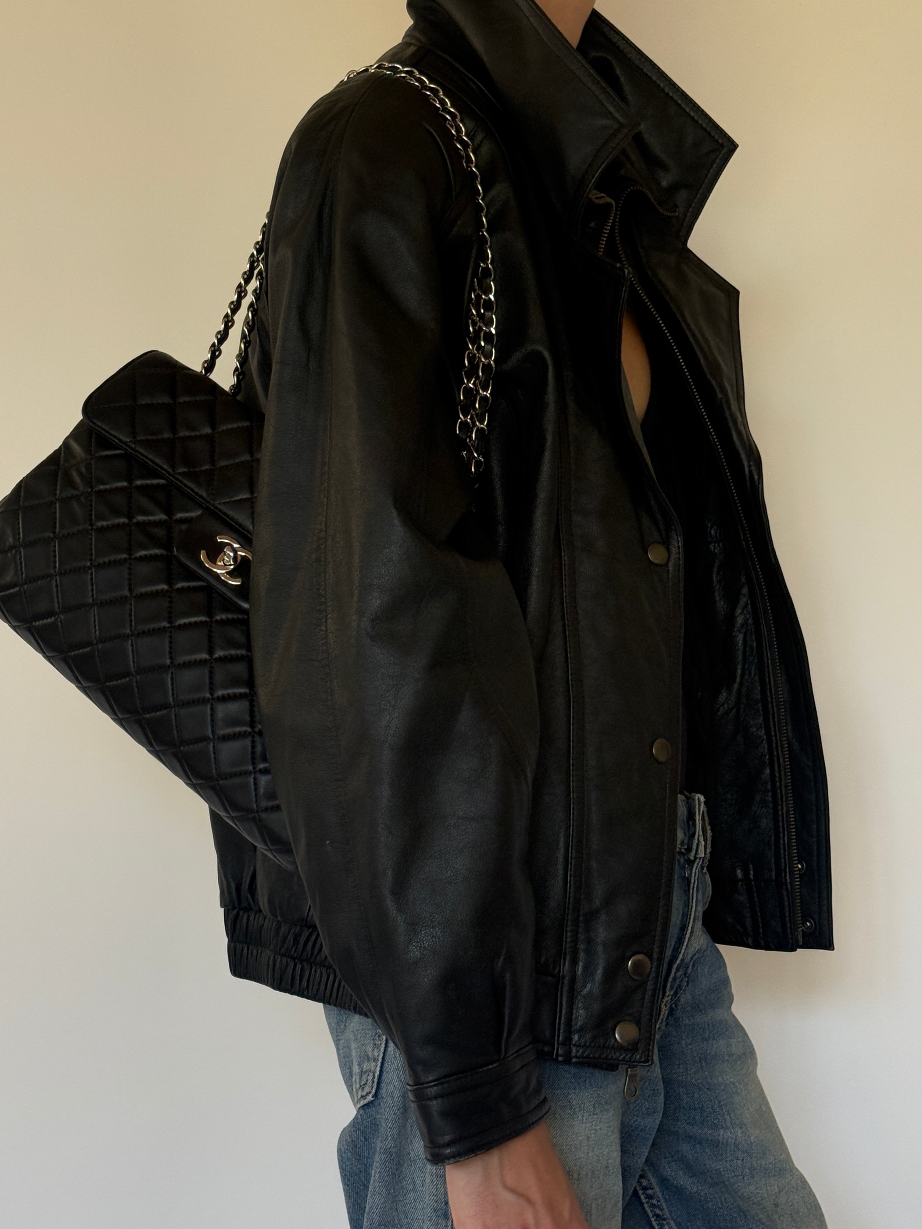Vintage oversized black leather bomber jacket side view