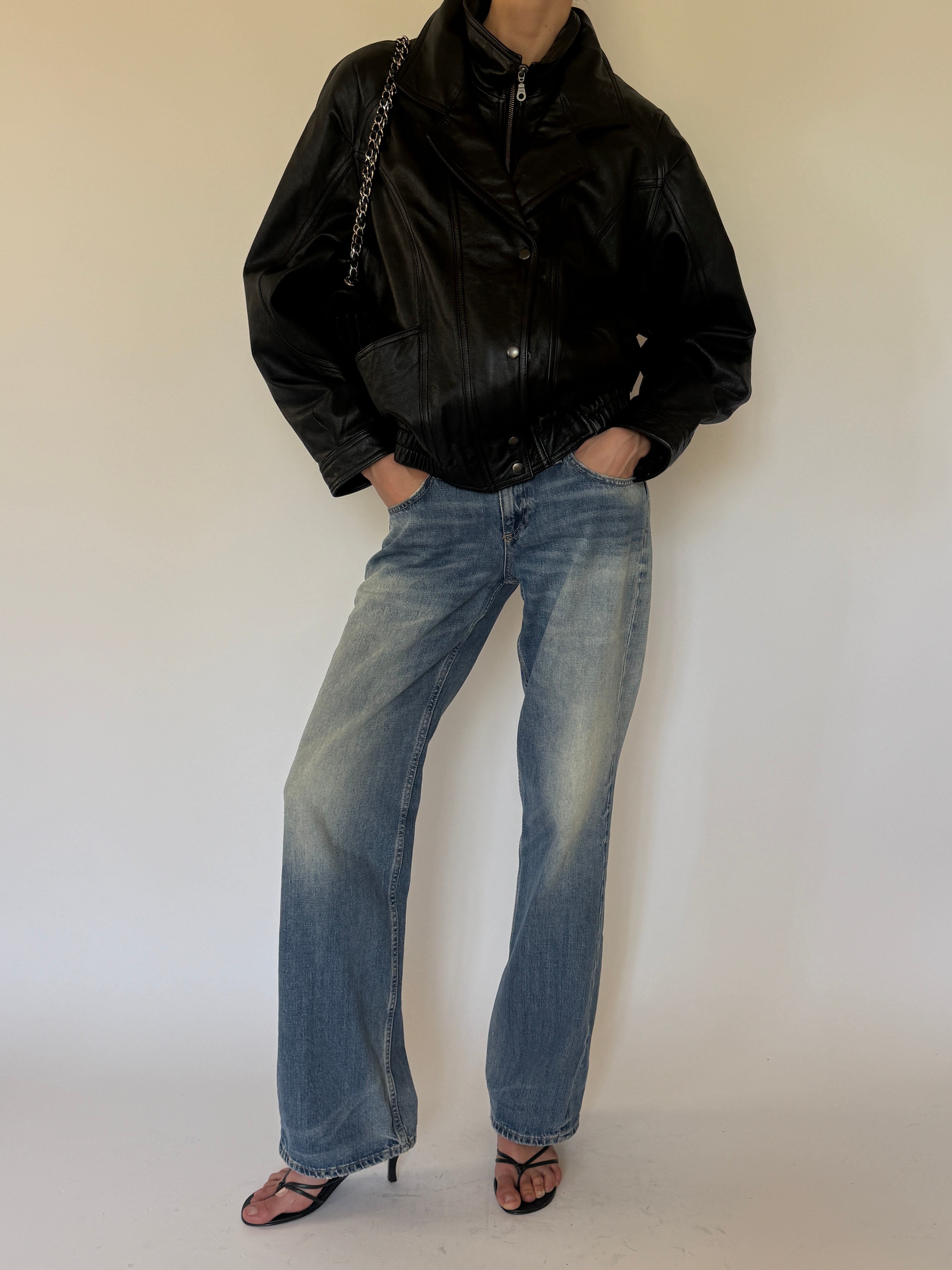 Vintage oversized black leather bomber jacket front view