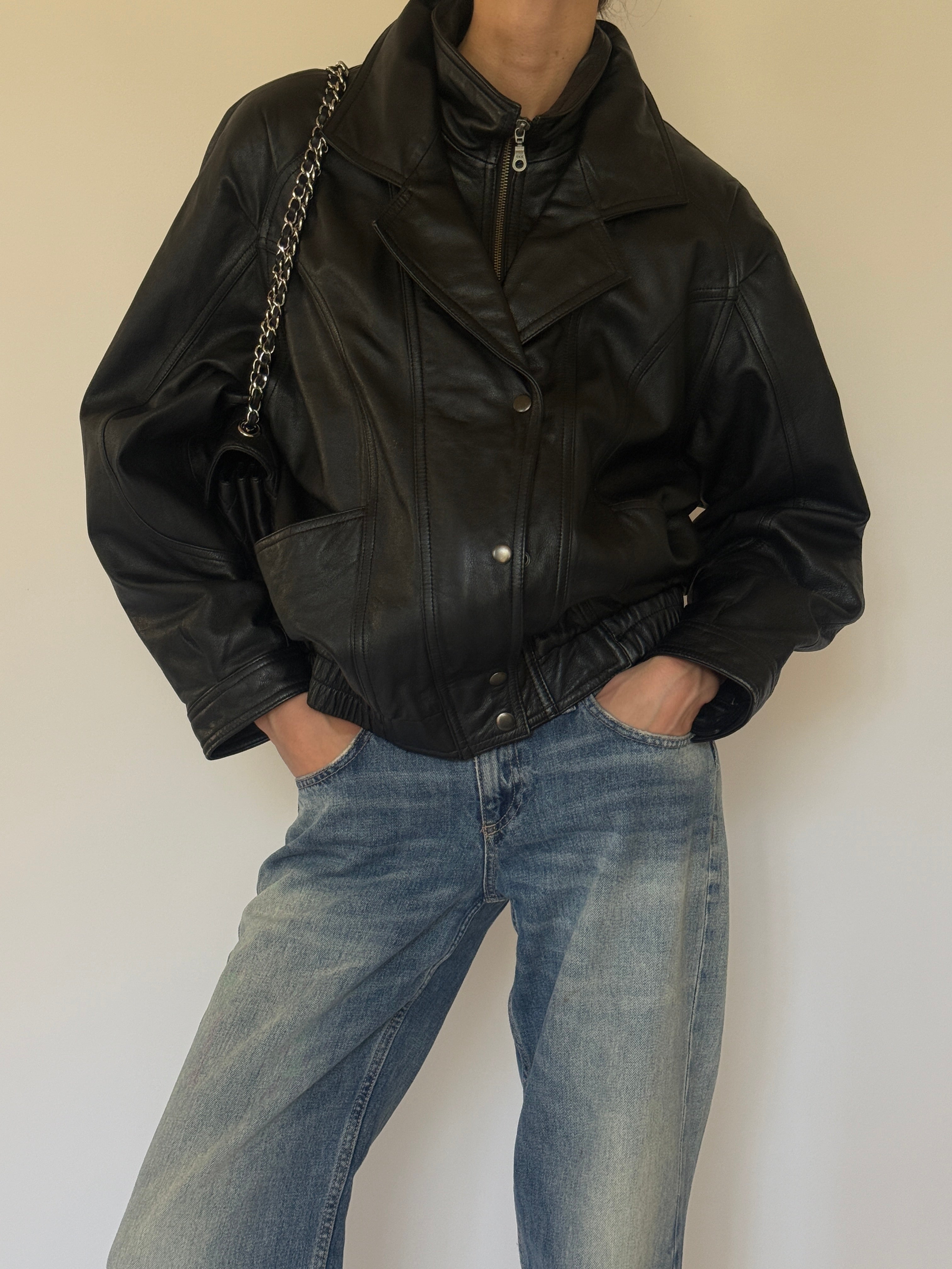Vintage oversized black leather bomber jacket front view