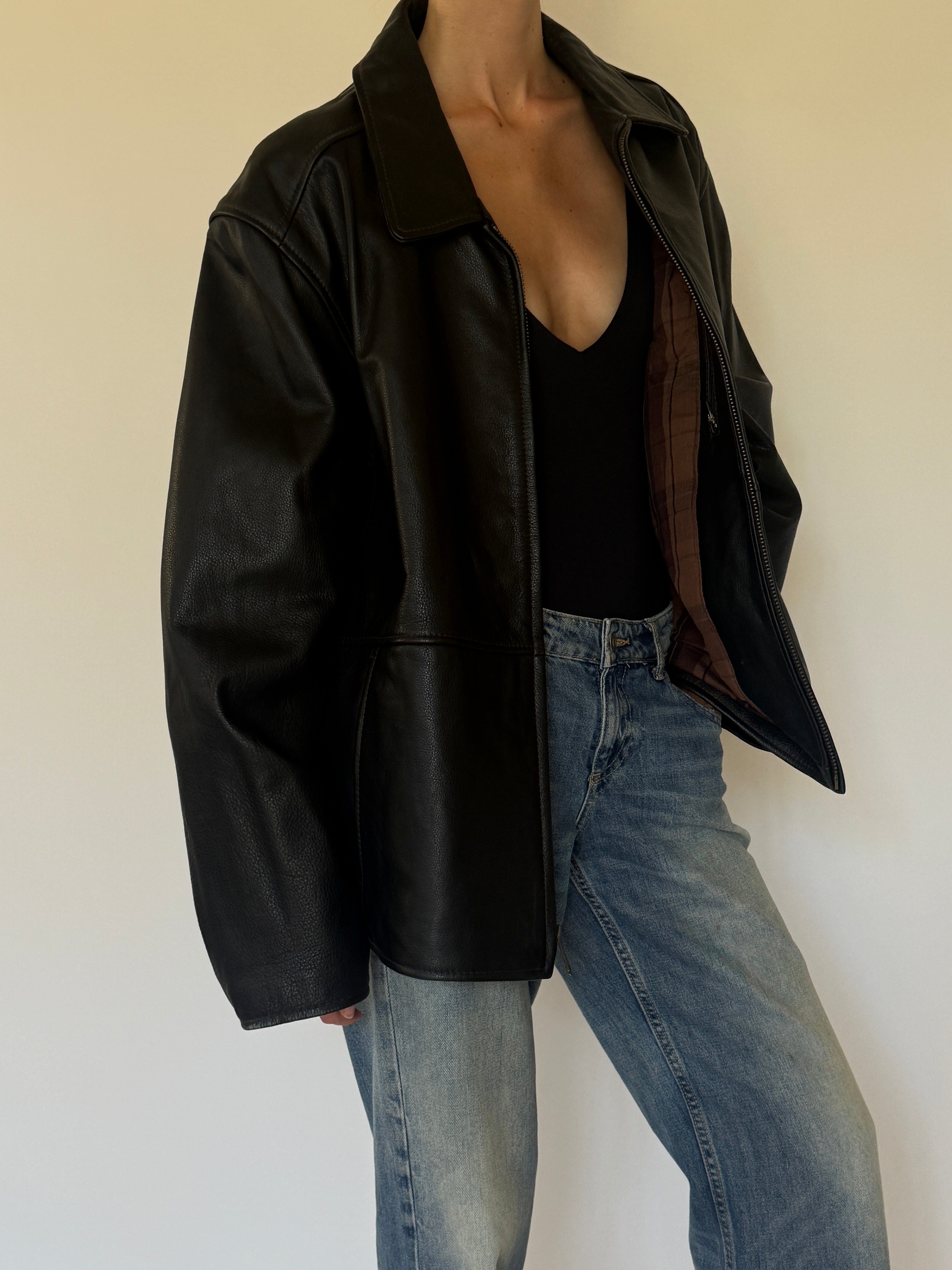 Vintage oversized black leather jacket side view