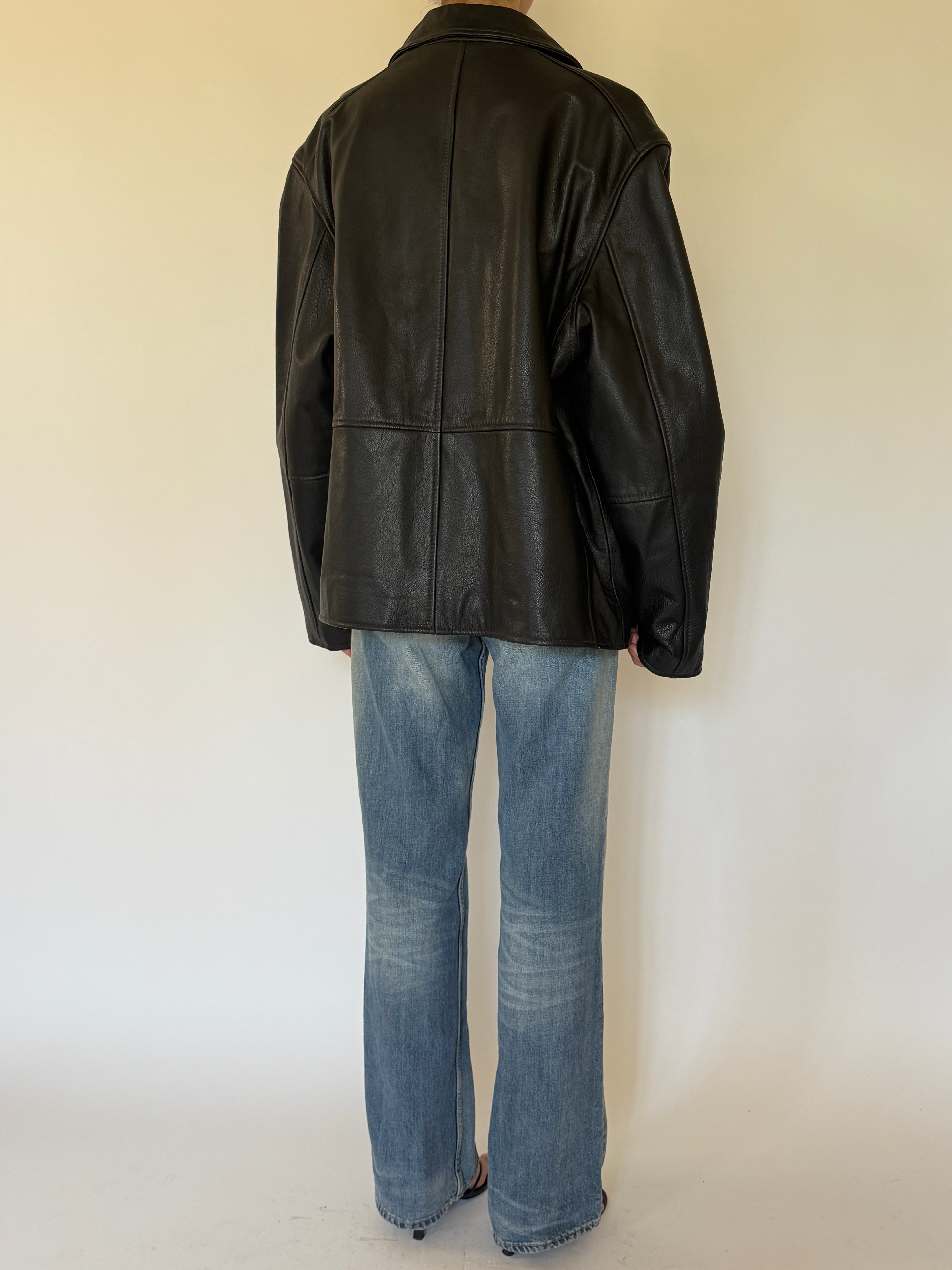 Vintage oversized black leather jacket back view