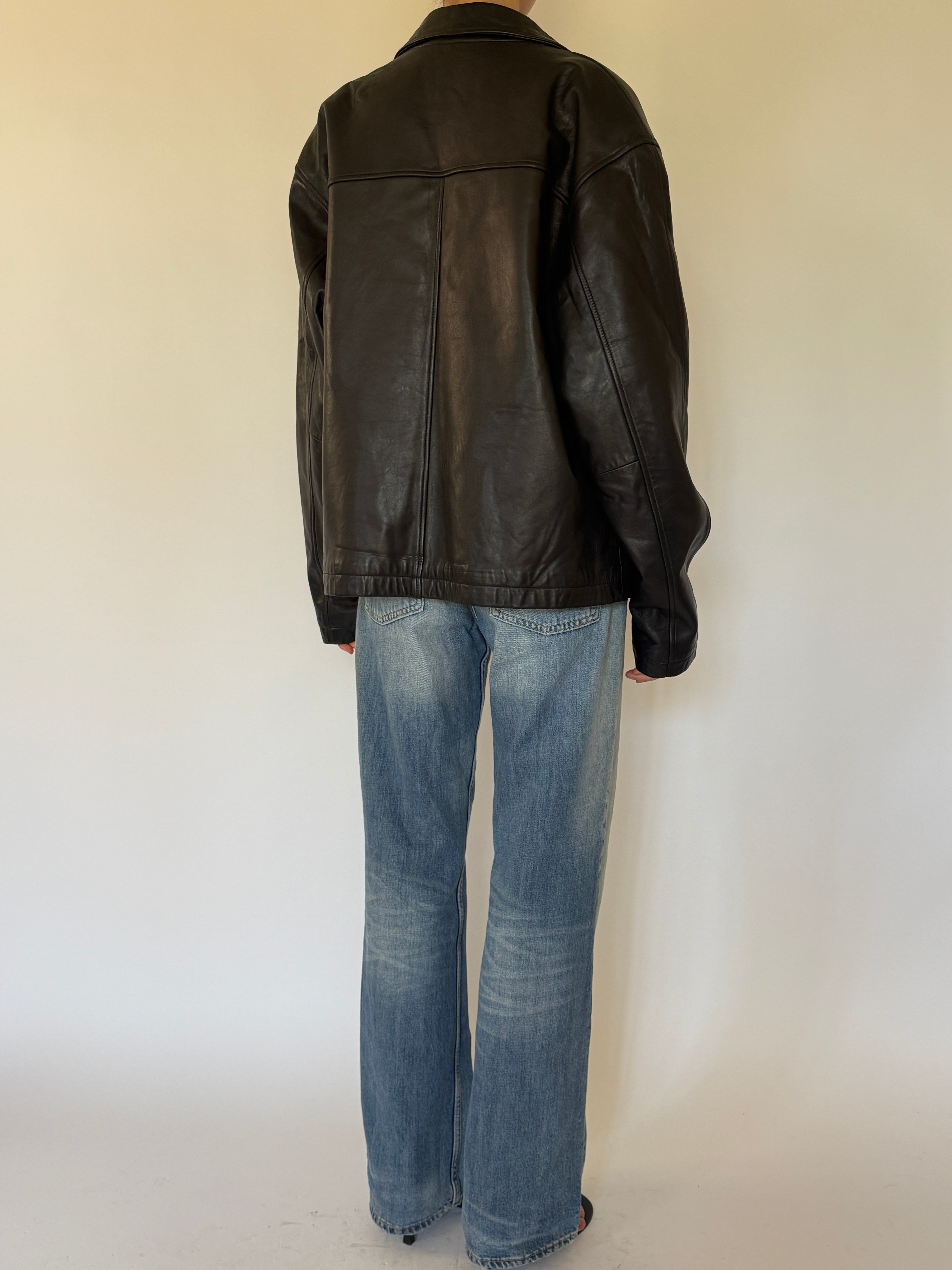 Vintage oversized black leather jacket back view