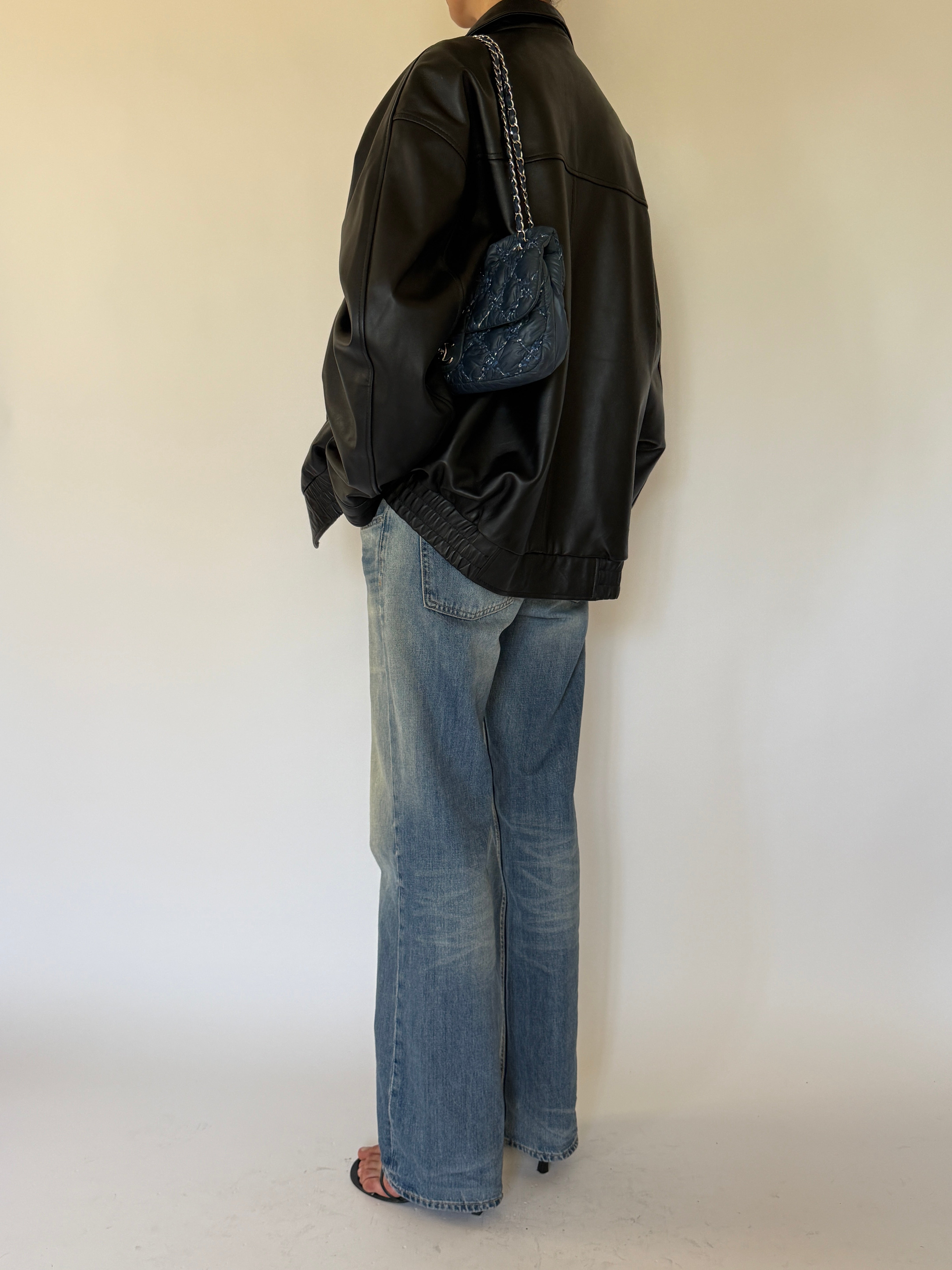 Vintage oversized black leather jacket back view