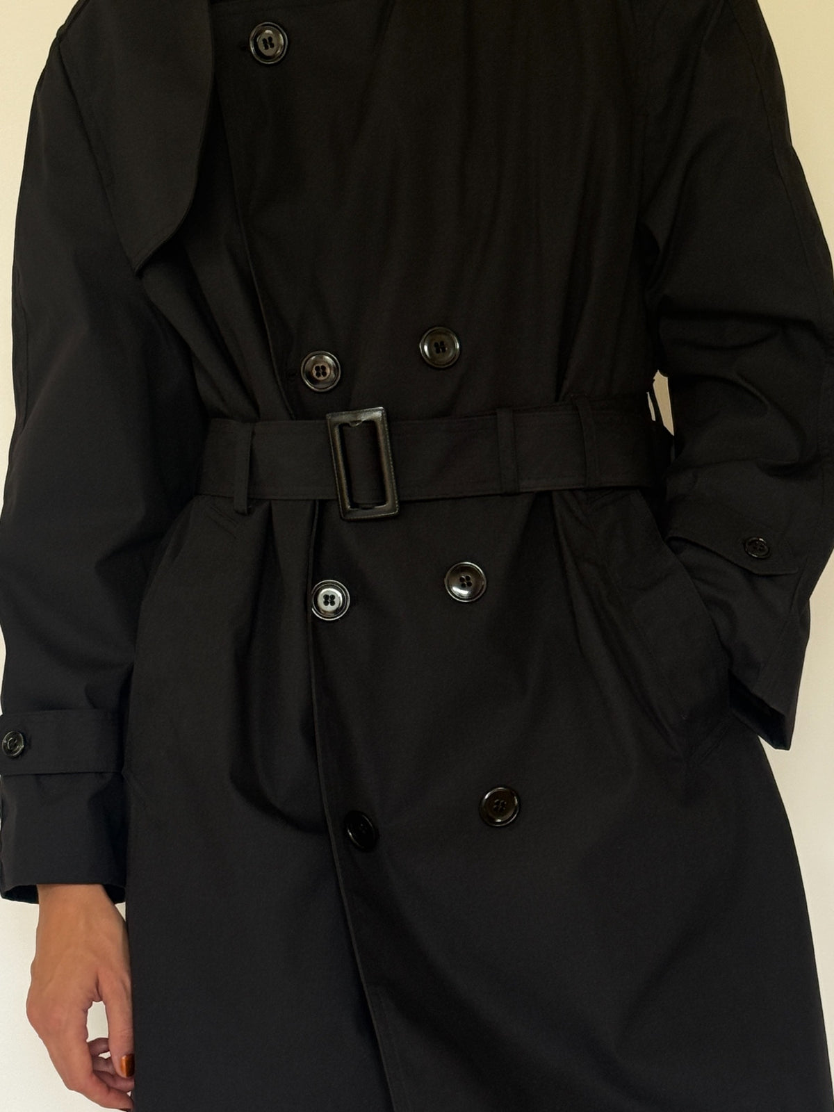 Vintage black trench coat button and belt detail