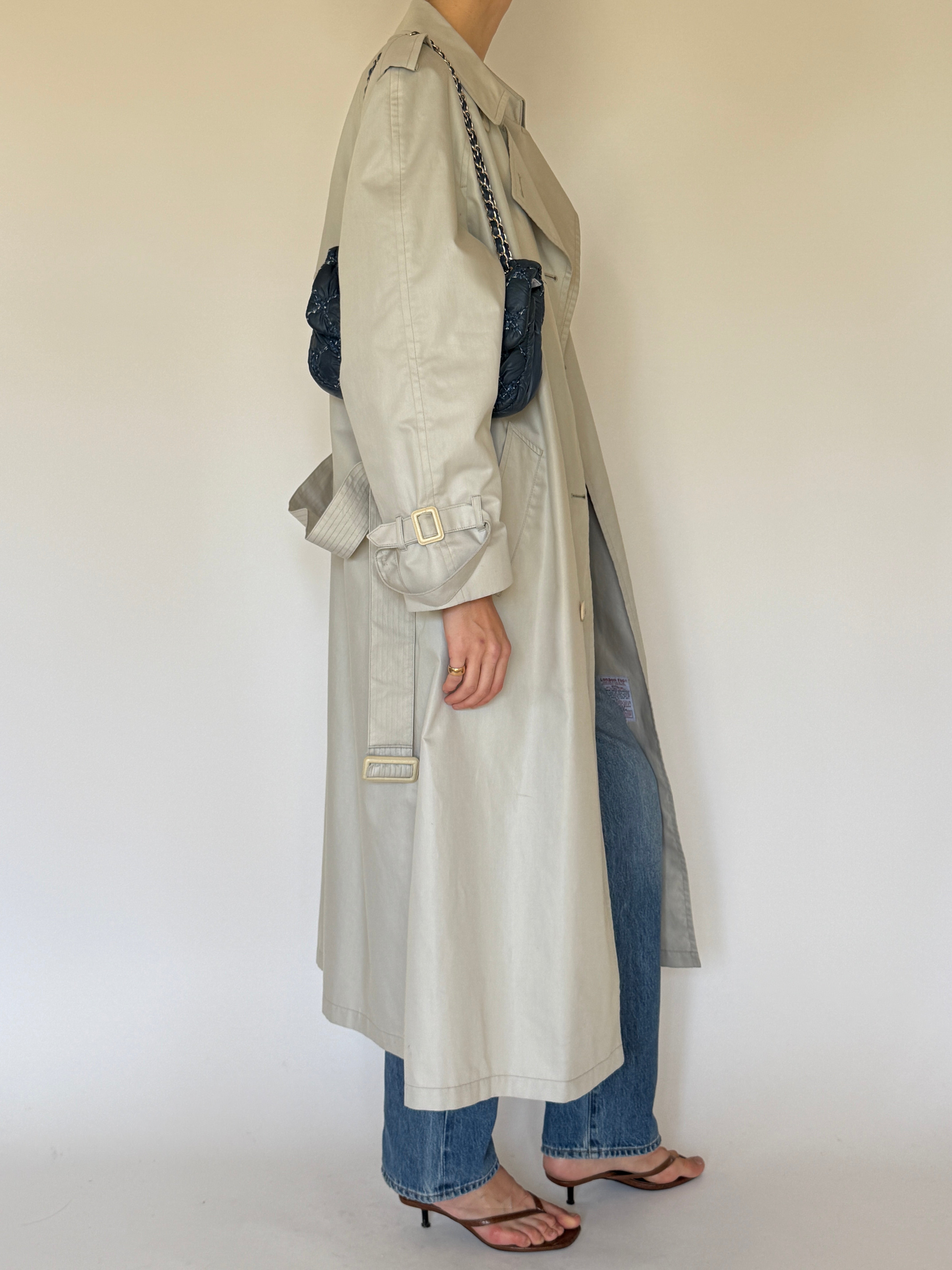 Vintage double-breasted trench coat side view