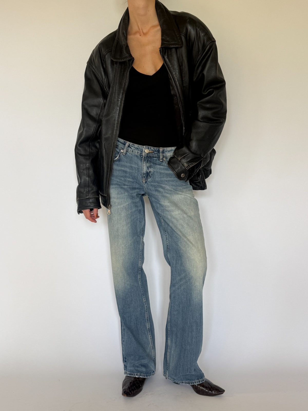 Vintage black leather bomber jacket front view
