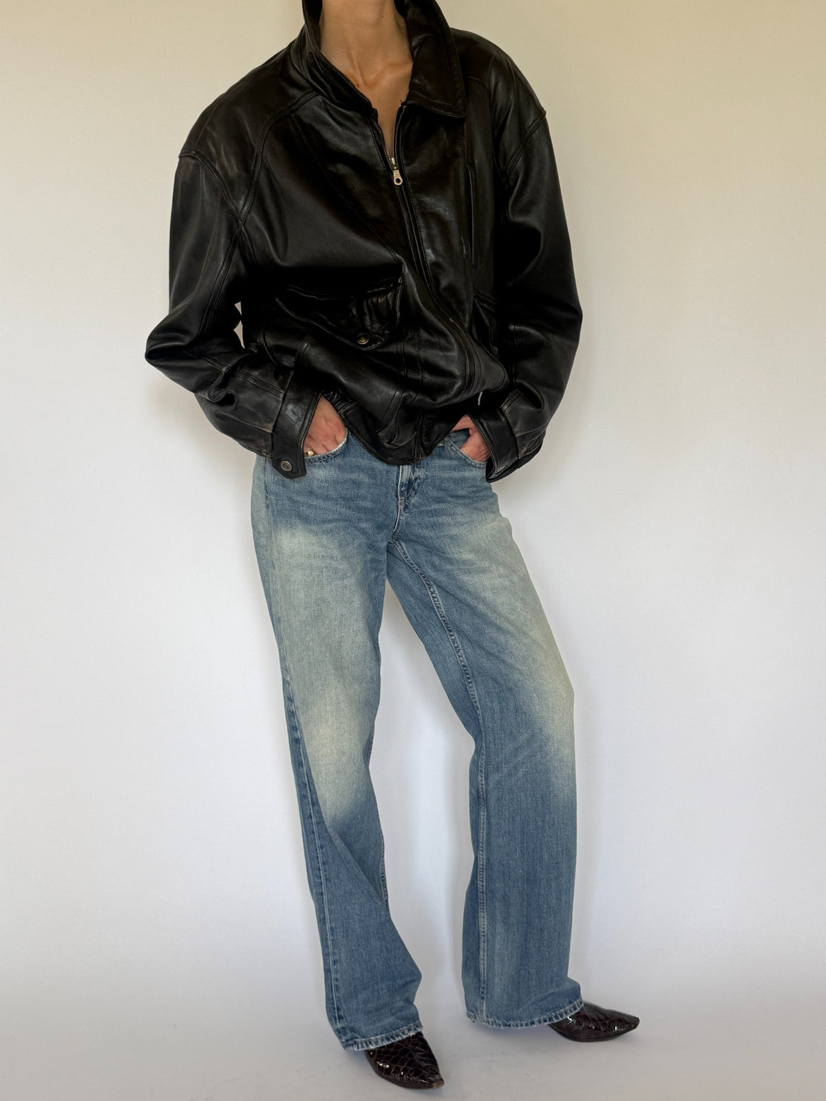 Vintage black leather bomber jacket front angle