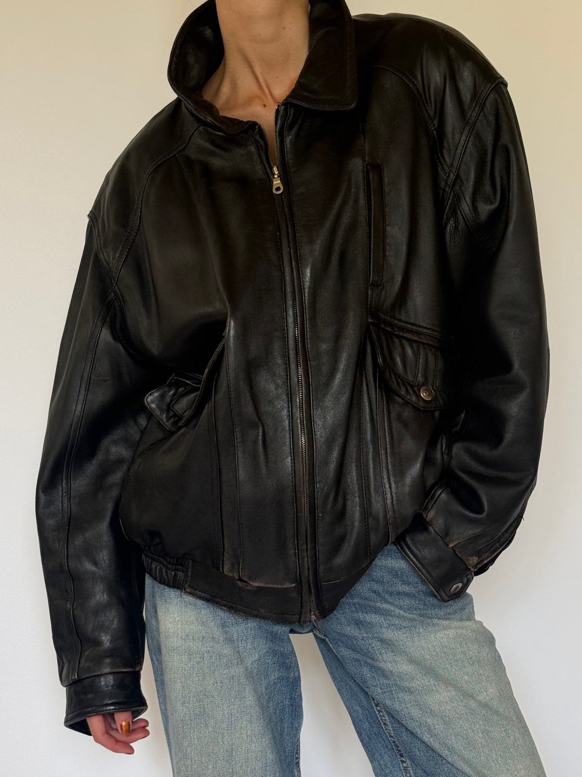 Vintage black leather bomber jacket leather and cuff detail