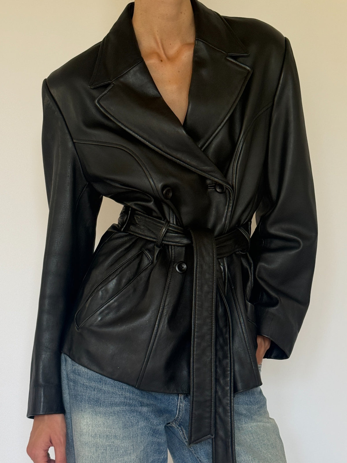 Vintage black leather belted jacket lapel detail
