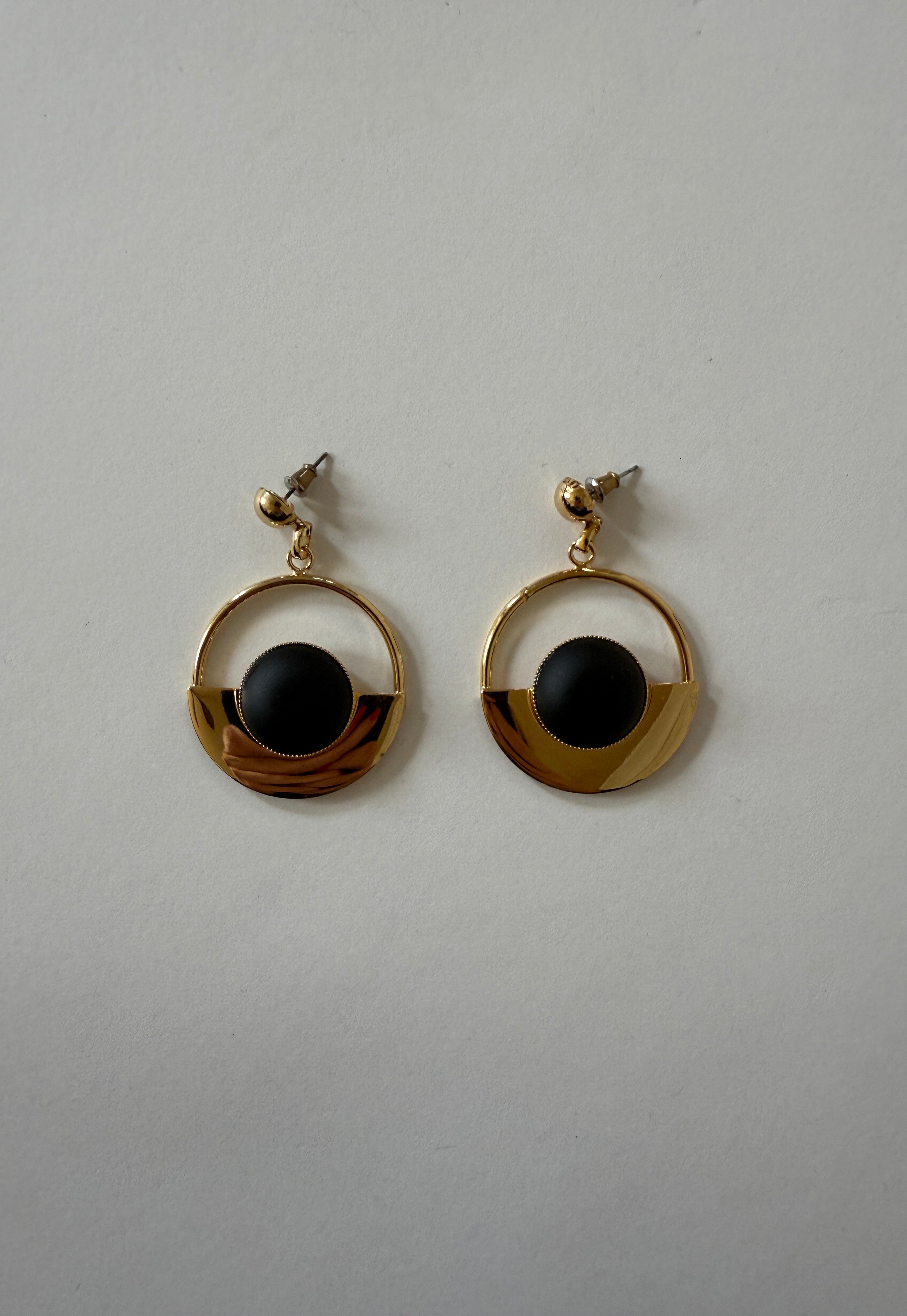 Gold-tone geometric drop earrings with black circular center