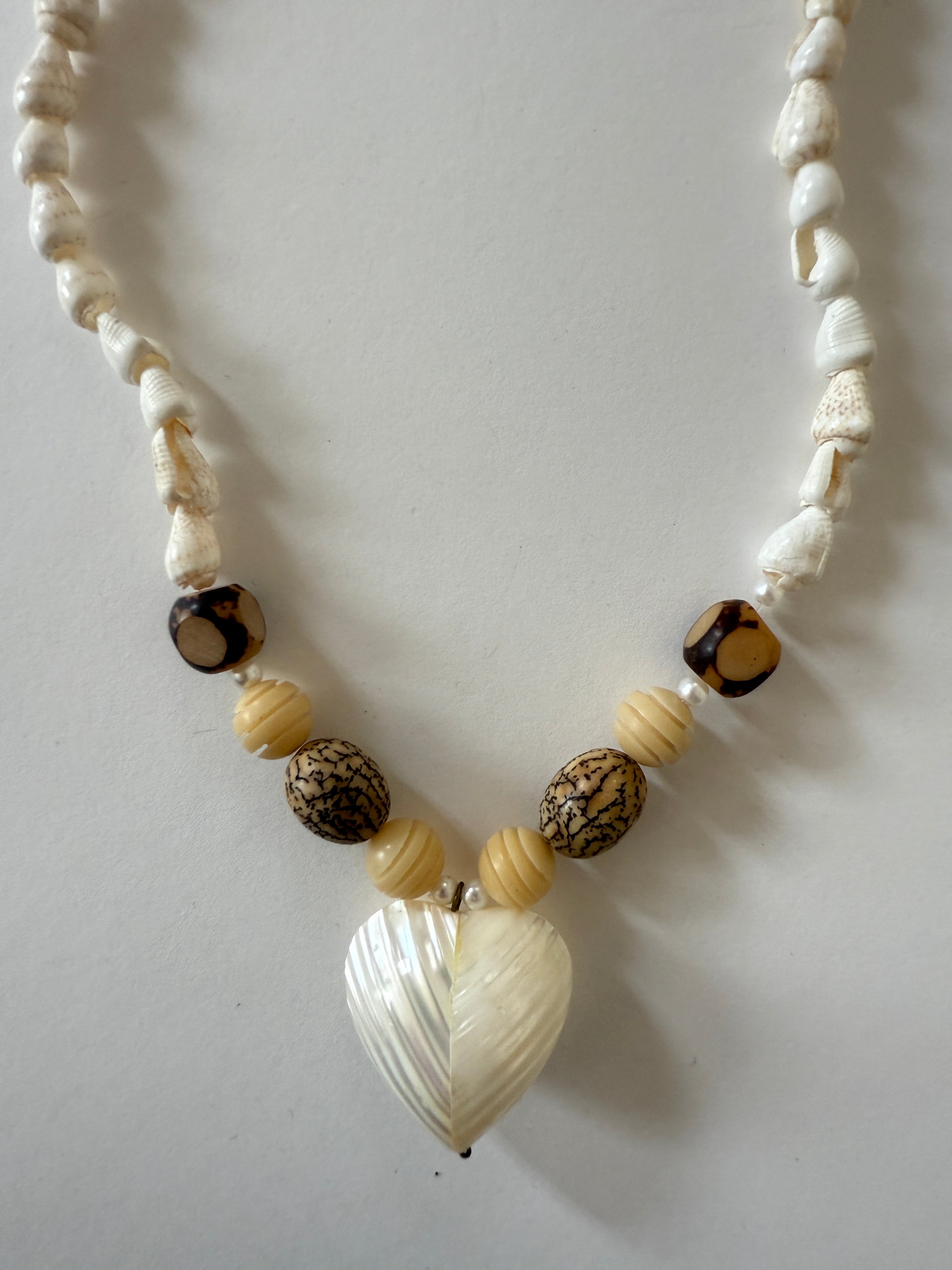 Vintage beaded heart pendant close-up