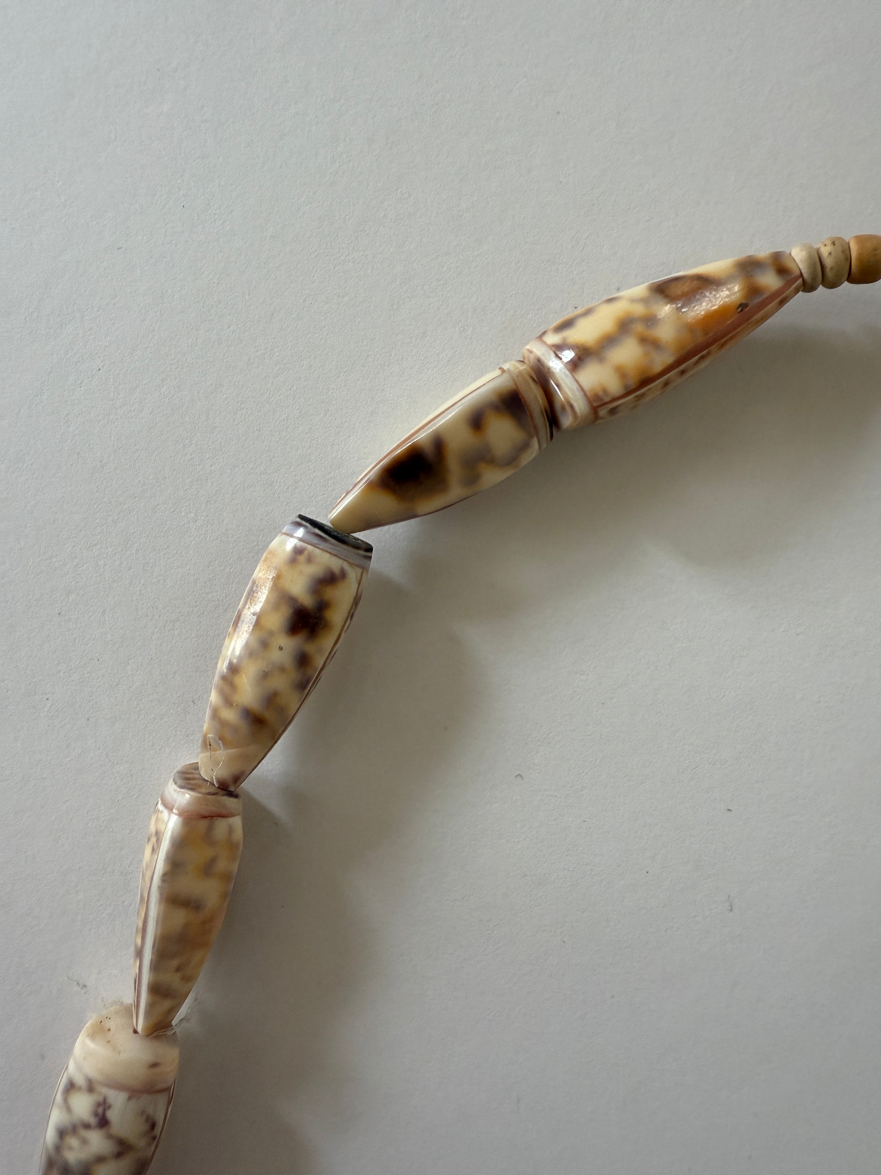 Vintage marbled shell bead necklace close-up