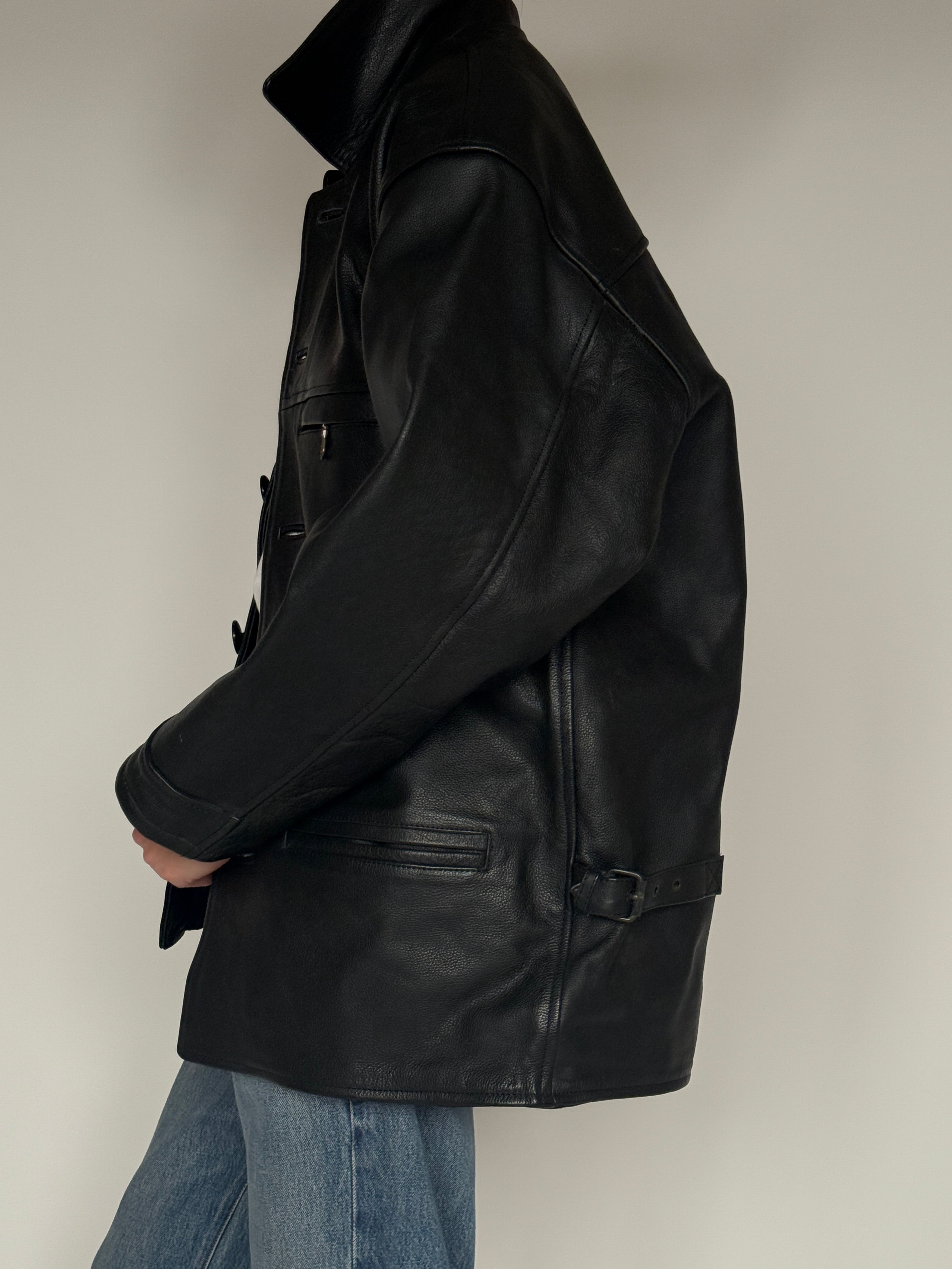 Vintage black leather jacket side view