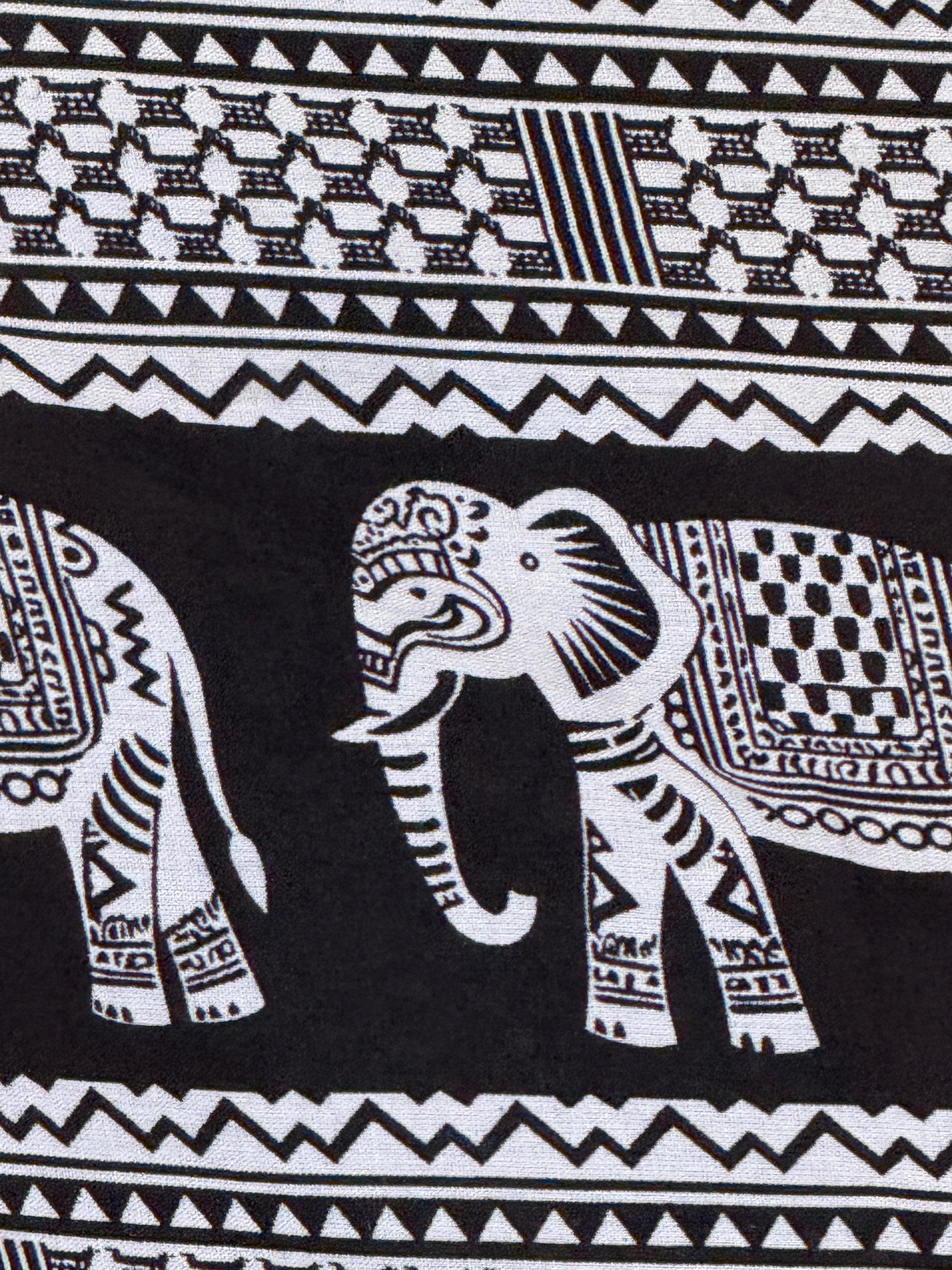 Vintage black and white elephant print wrap sarong fabric close-up detail