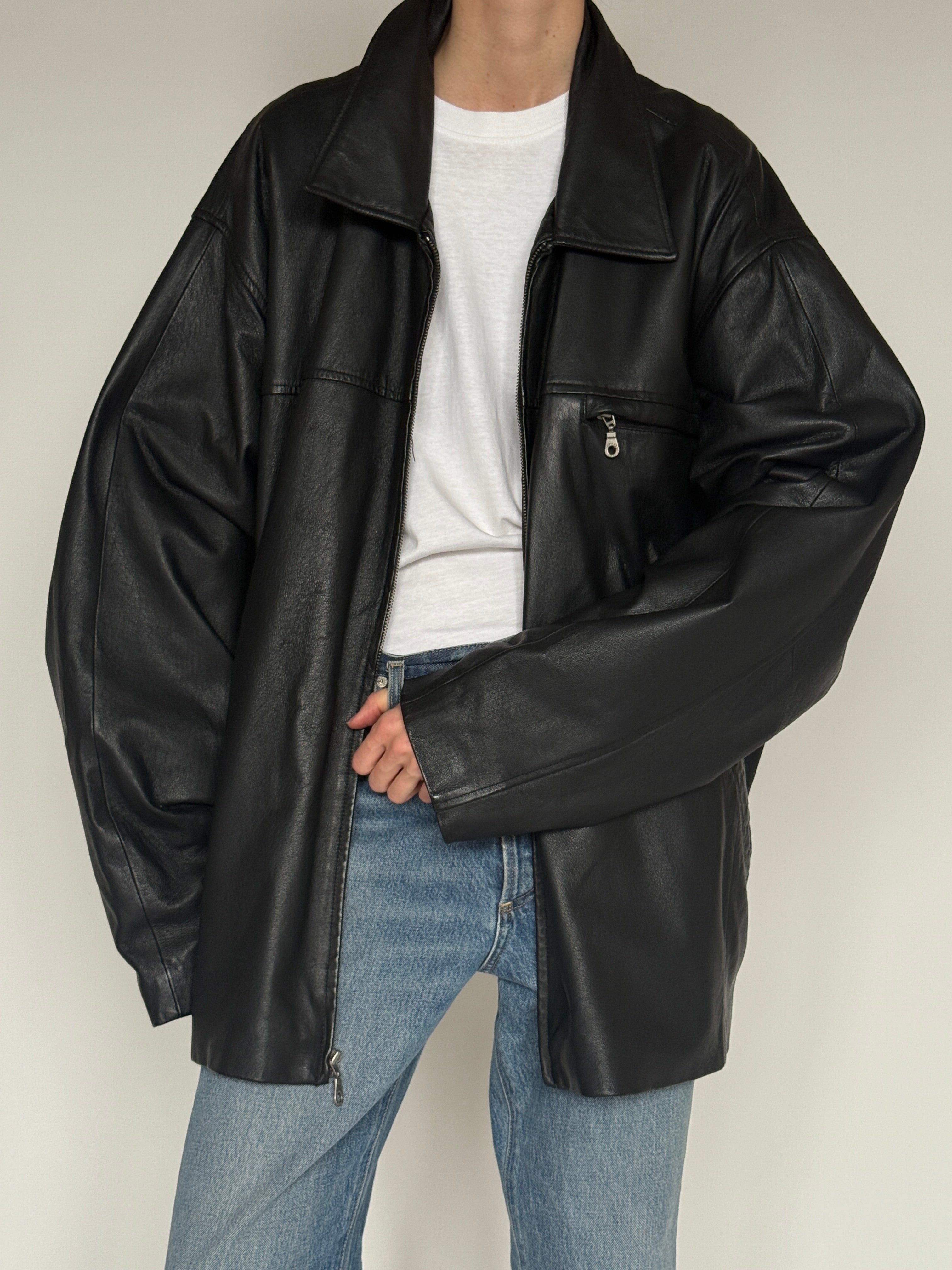 Vintage black leather jacket zipper detail