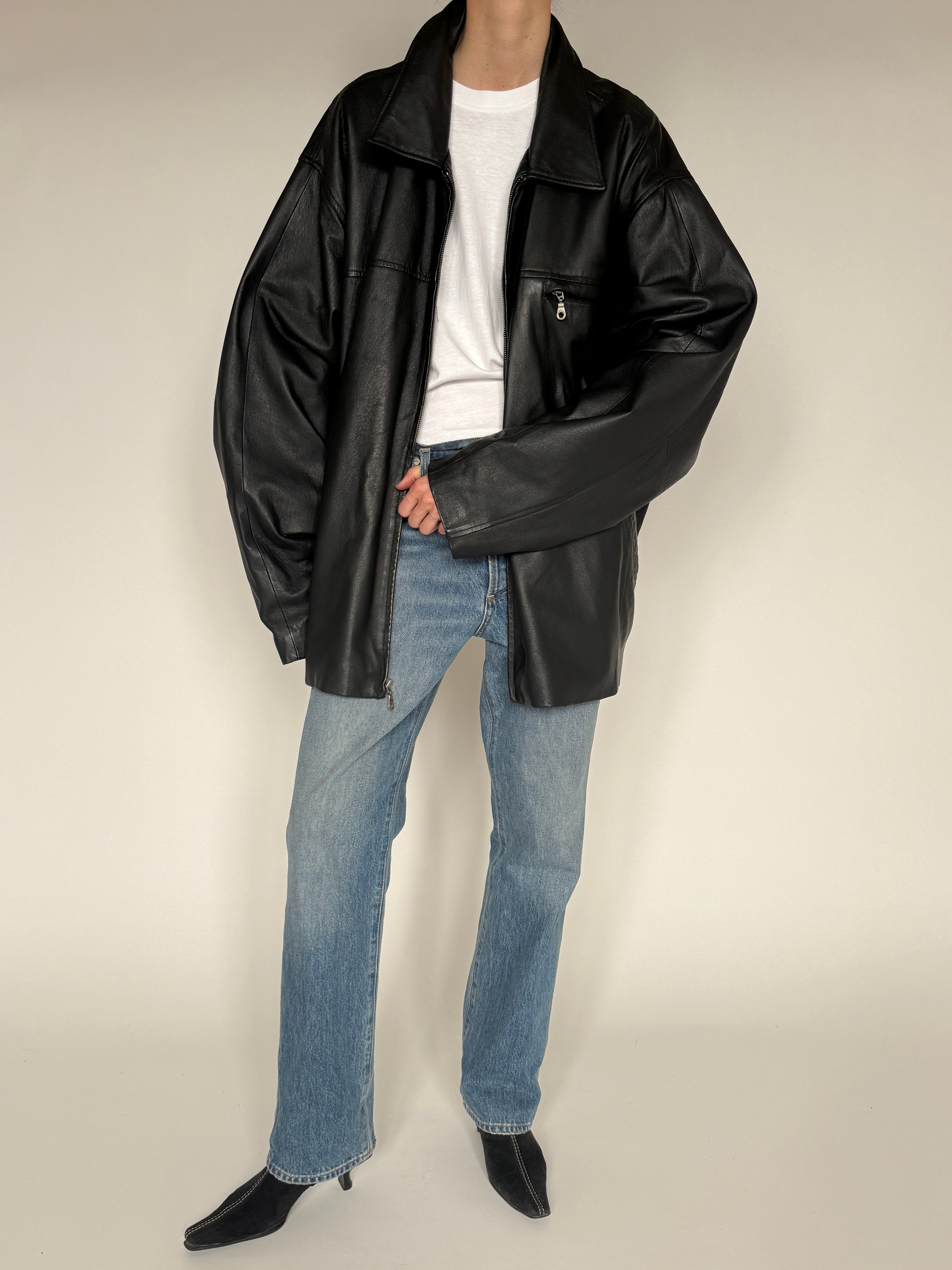 Vintage black leather jacket zipper detail