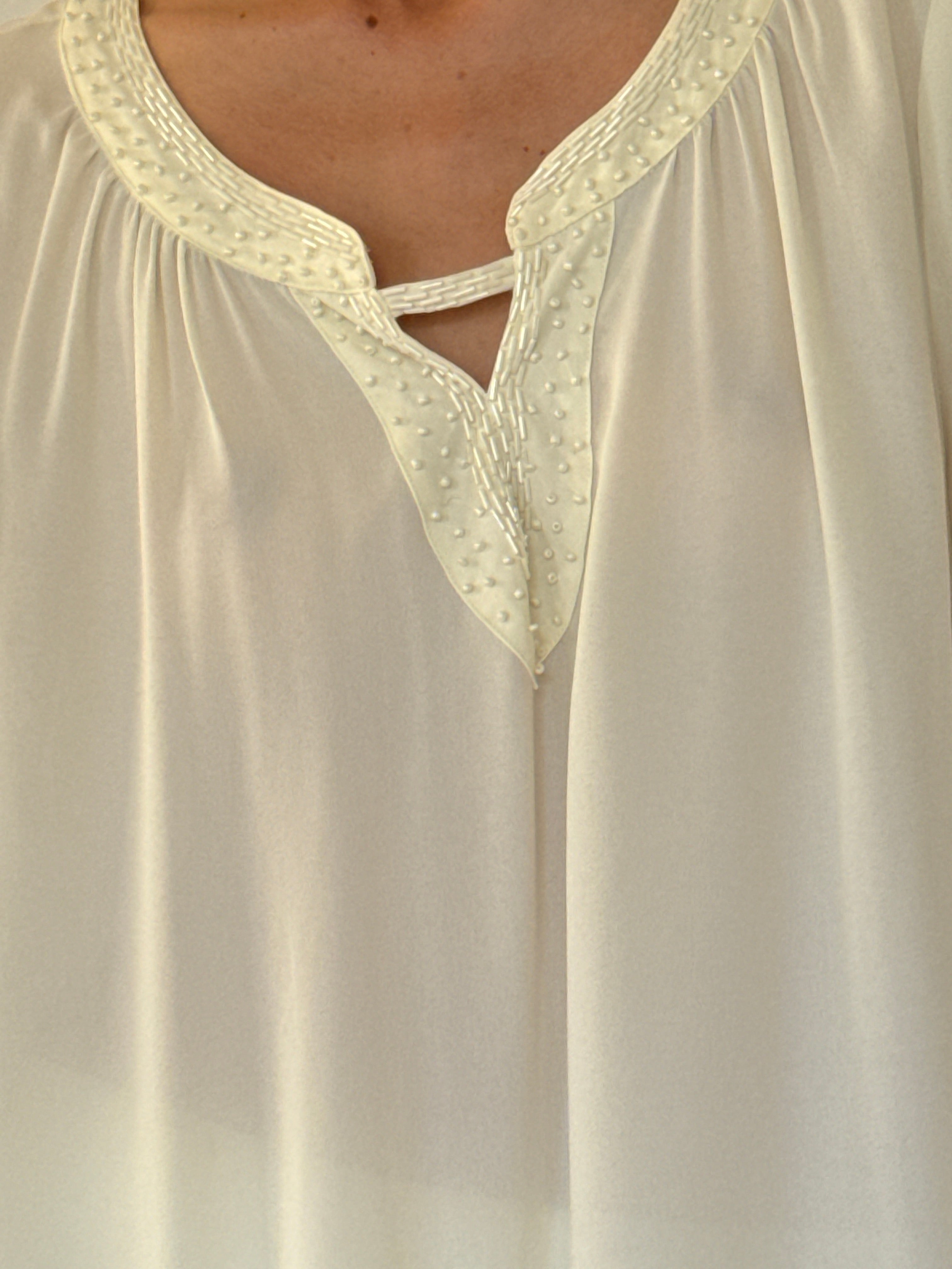 Vintage ivory blouse beaded neckline close-up