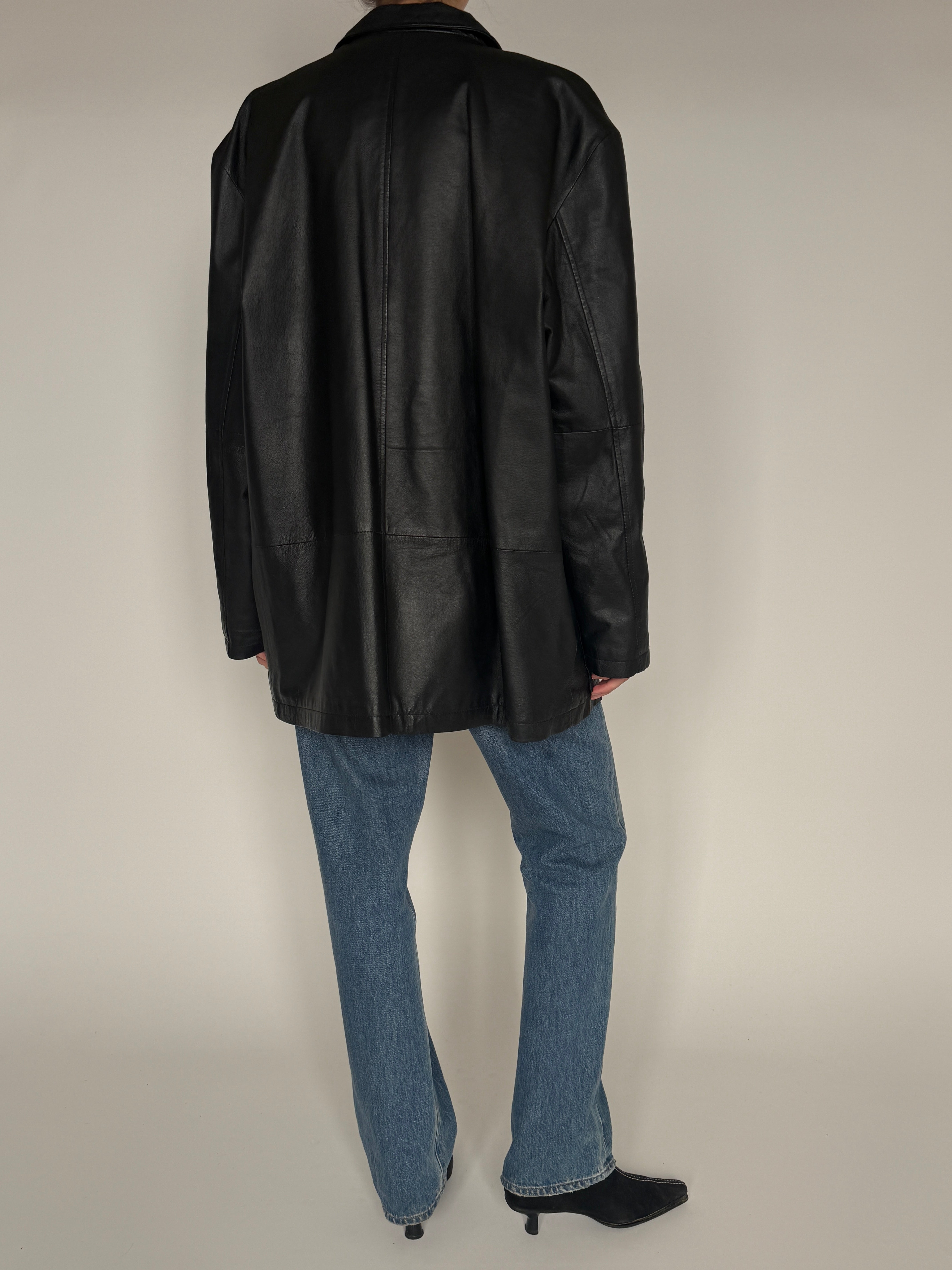 Vintage black leather jacket back view