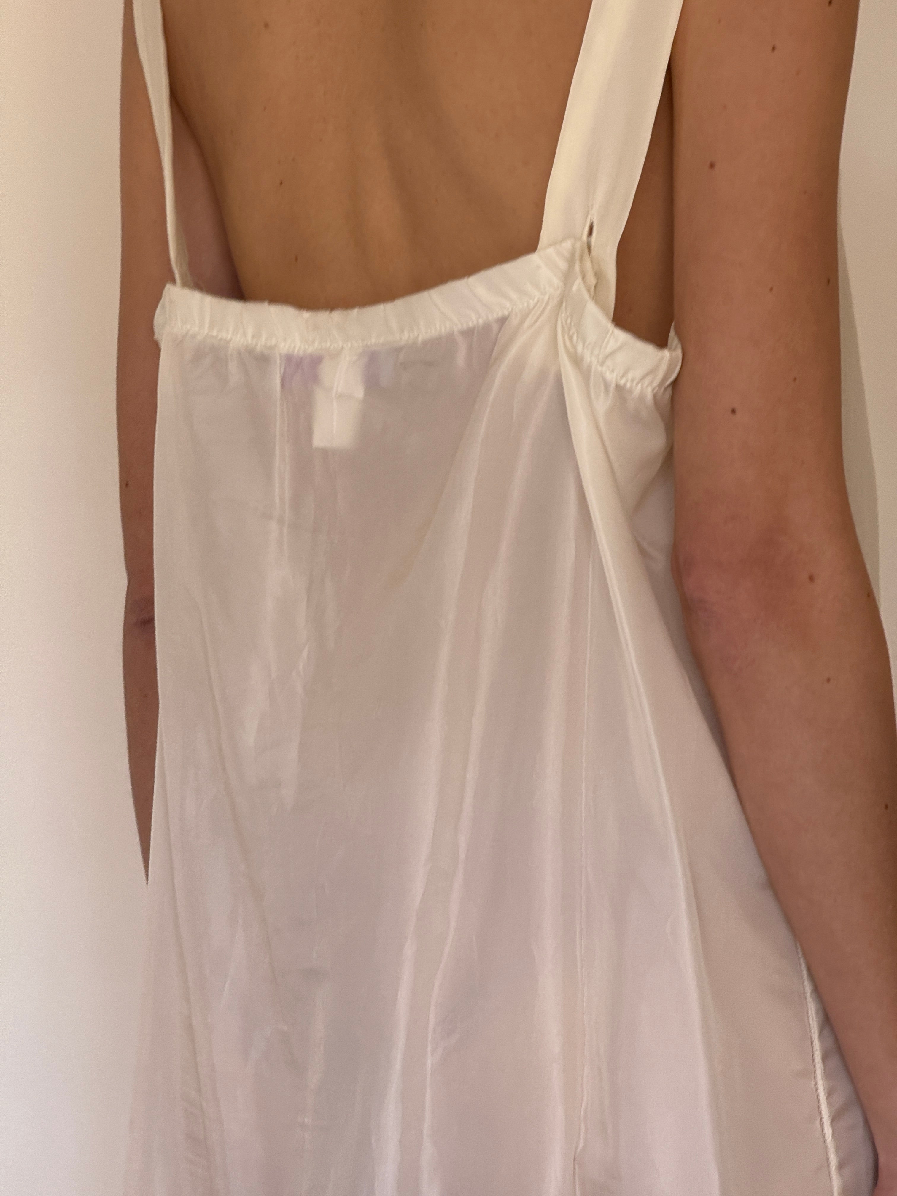 Vintage ivory slip dress worn on its own