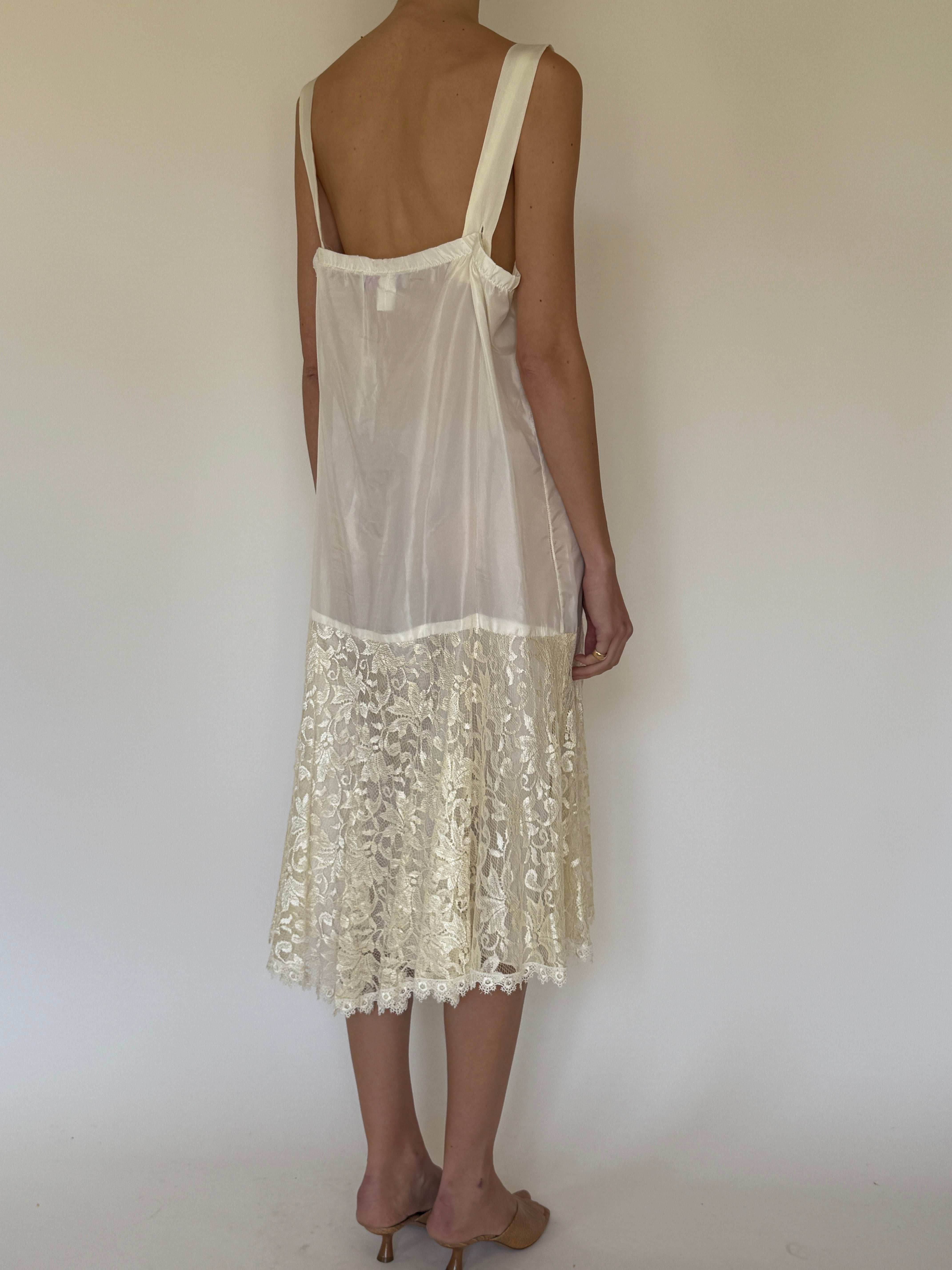 Vintage ivory slip dress worn on its own