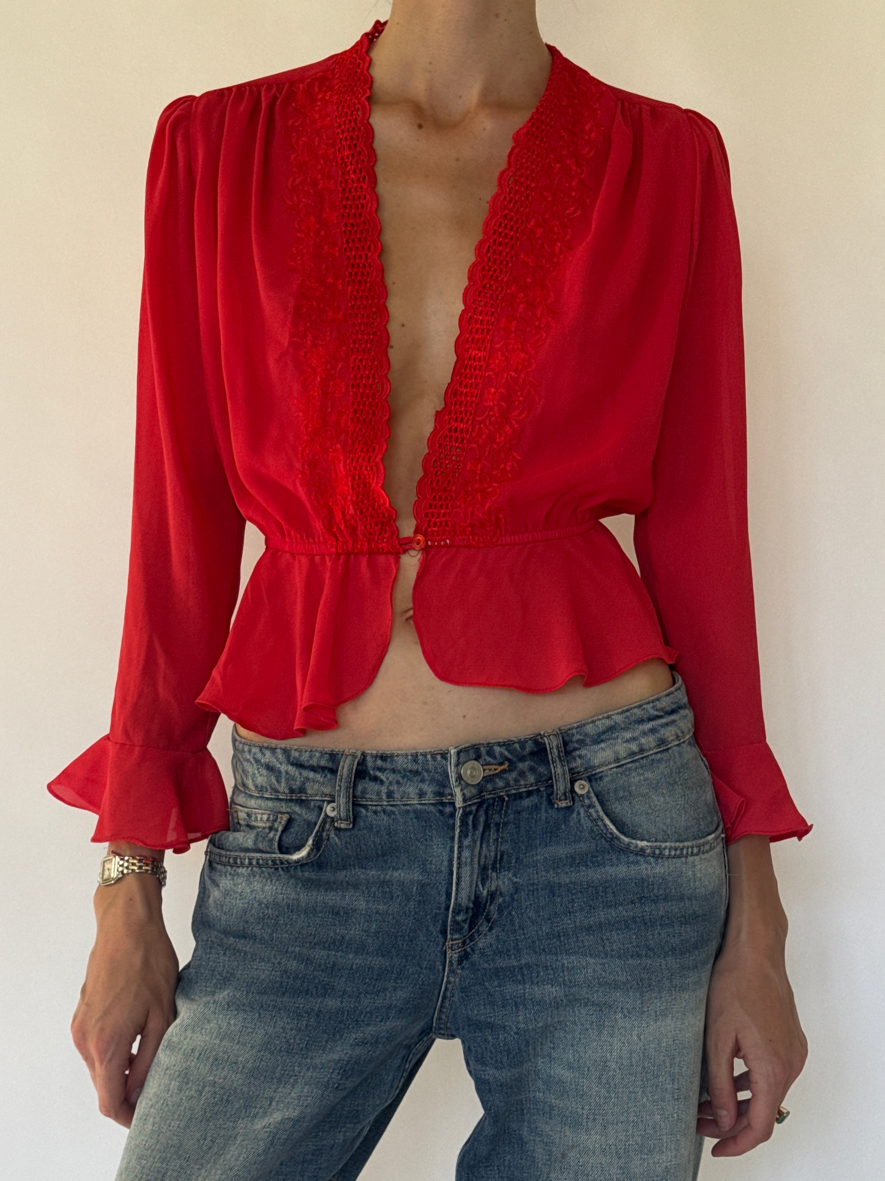 Vintage red blouse lace neckline close-up