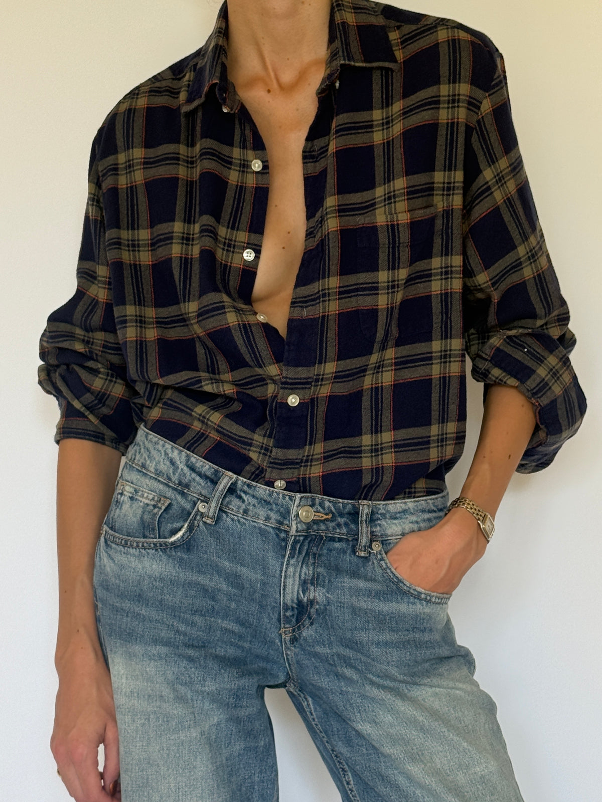 Vintage navy plaid flannel shirt fabric close-up