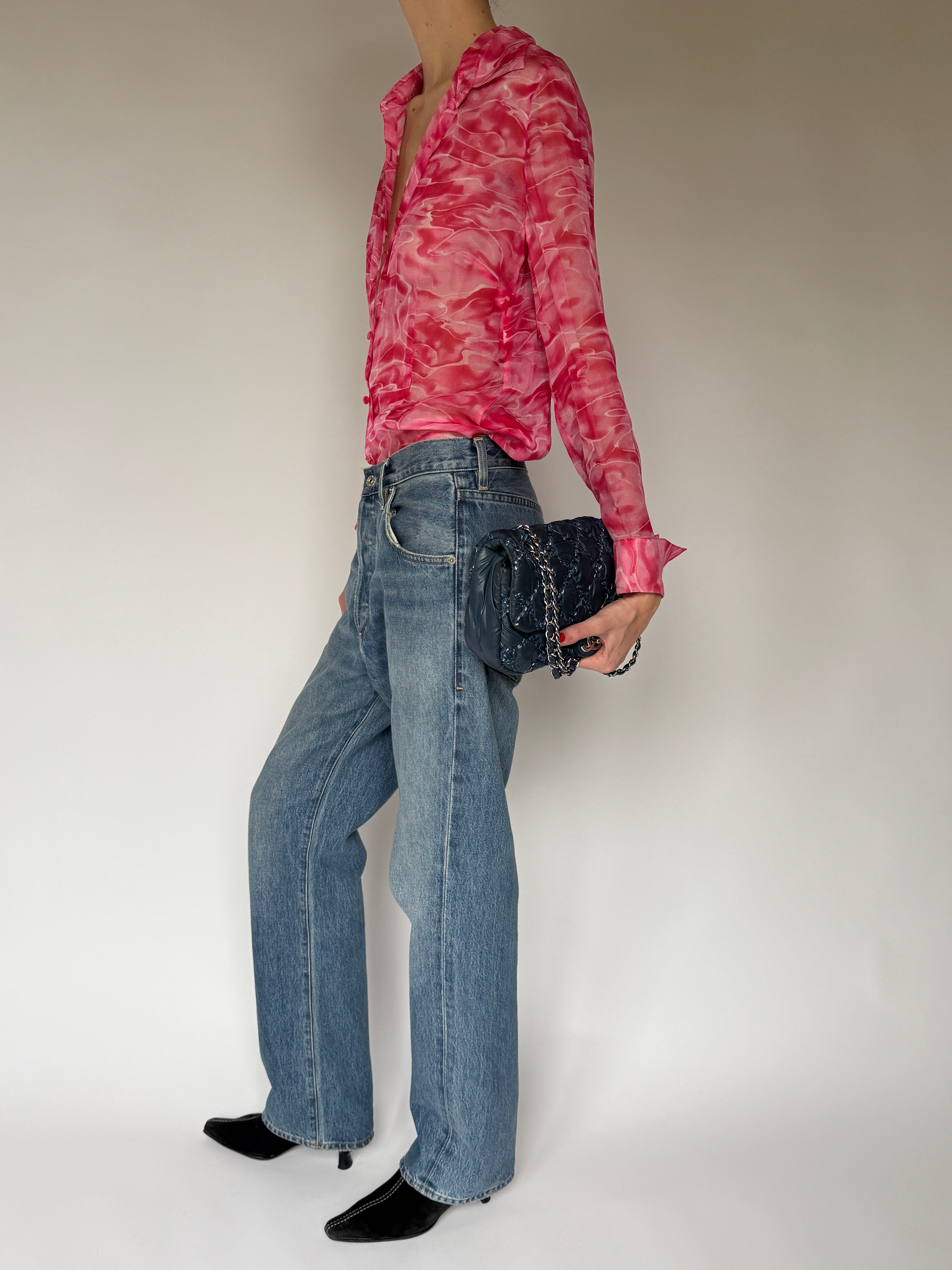 Side view of sheer pink swirl vintage blouse