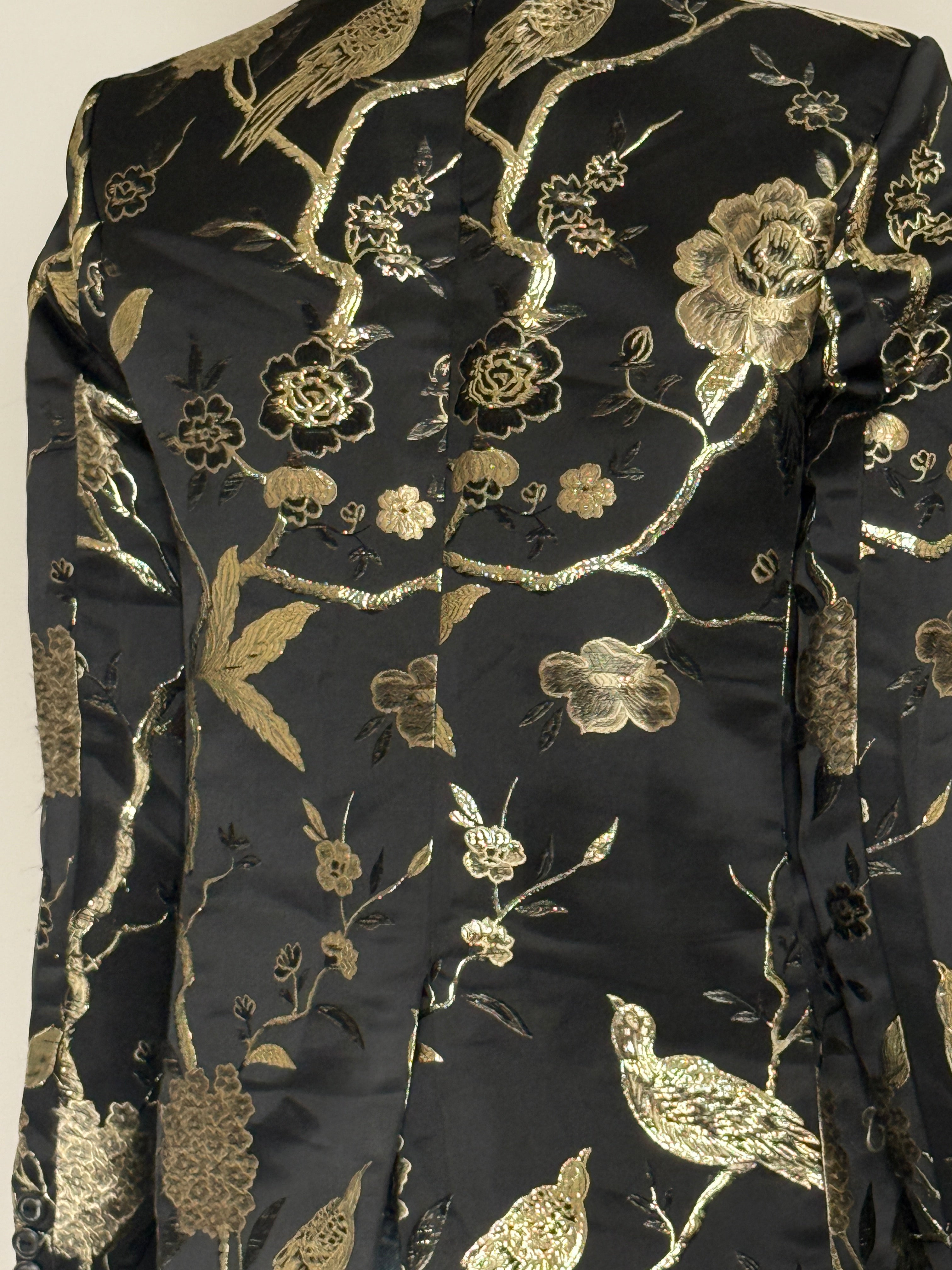 Vintage black blazer gold embroidery fabric close-up
