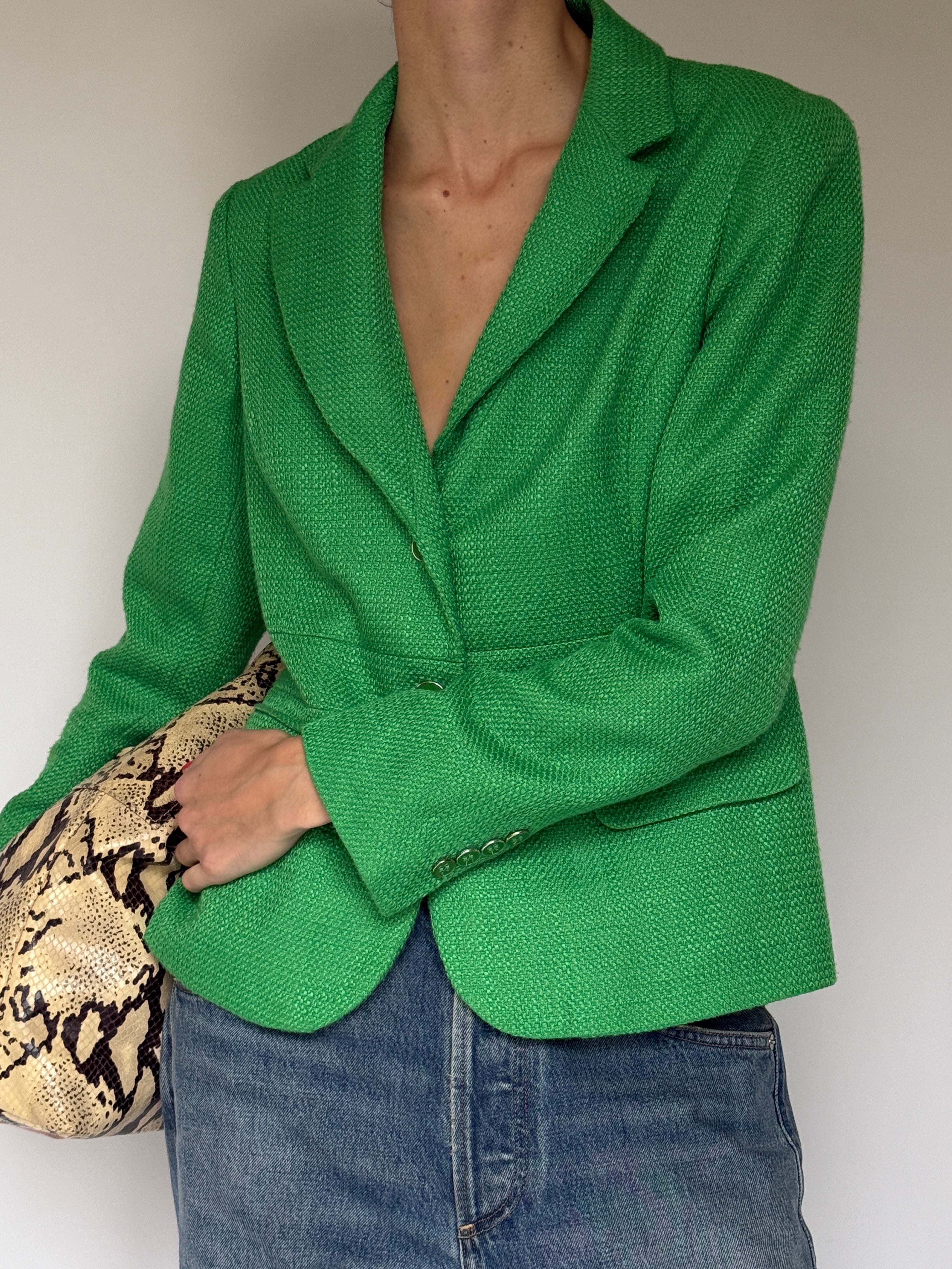 Green vintage blazer with notched lapel and single-button closure styled