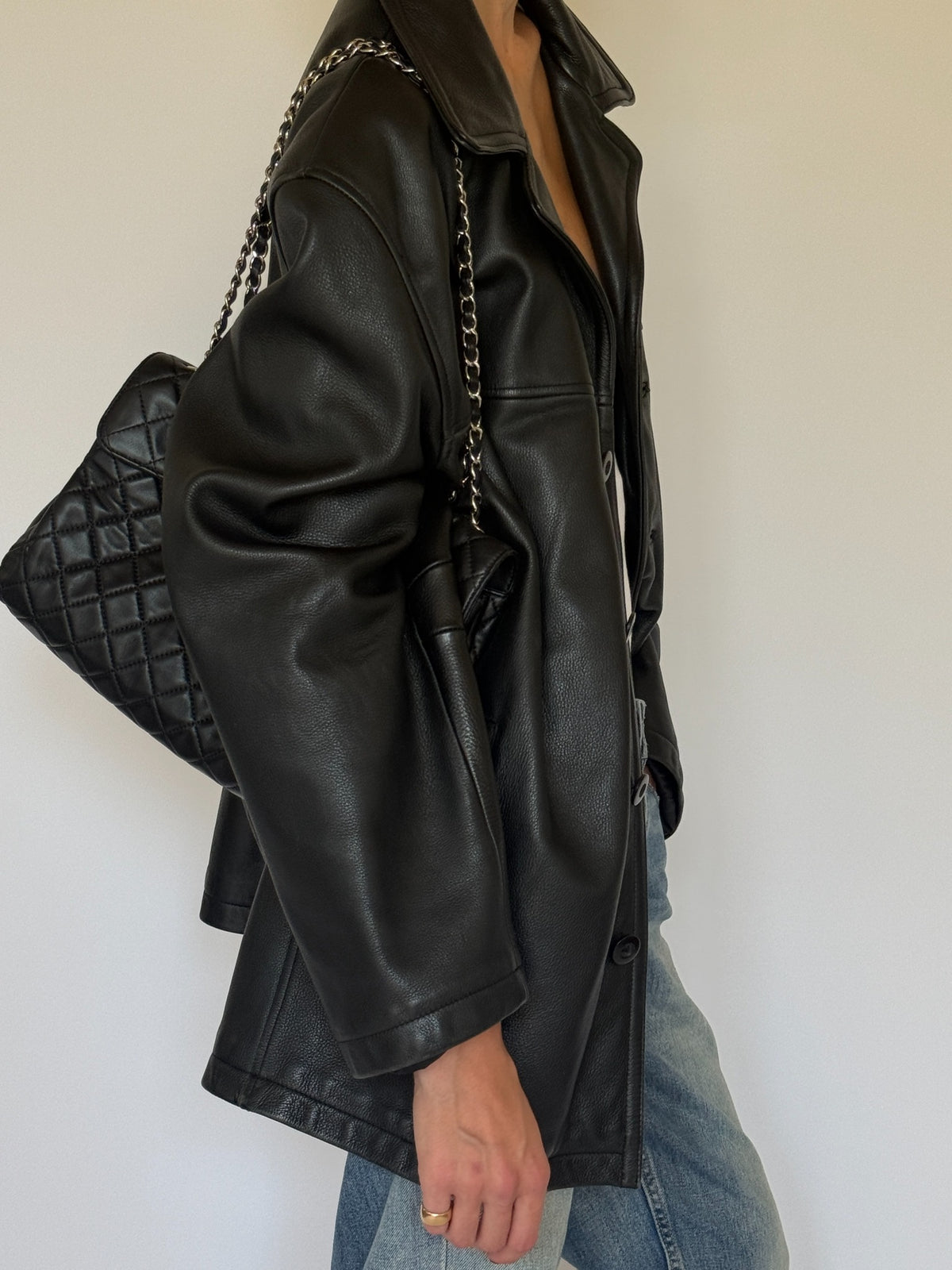 Vintage black leather jacket side view