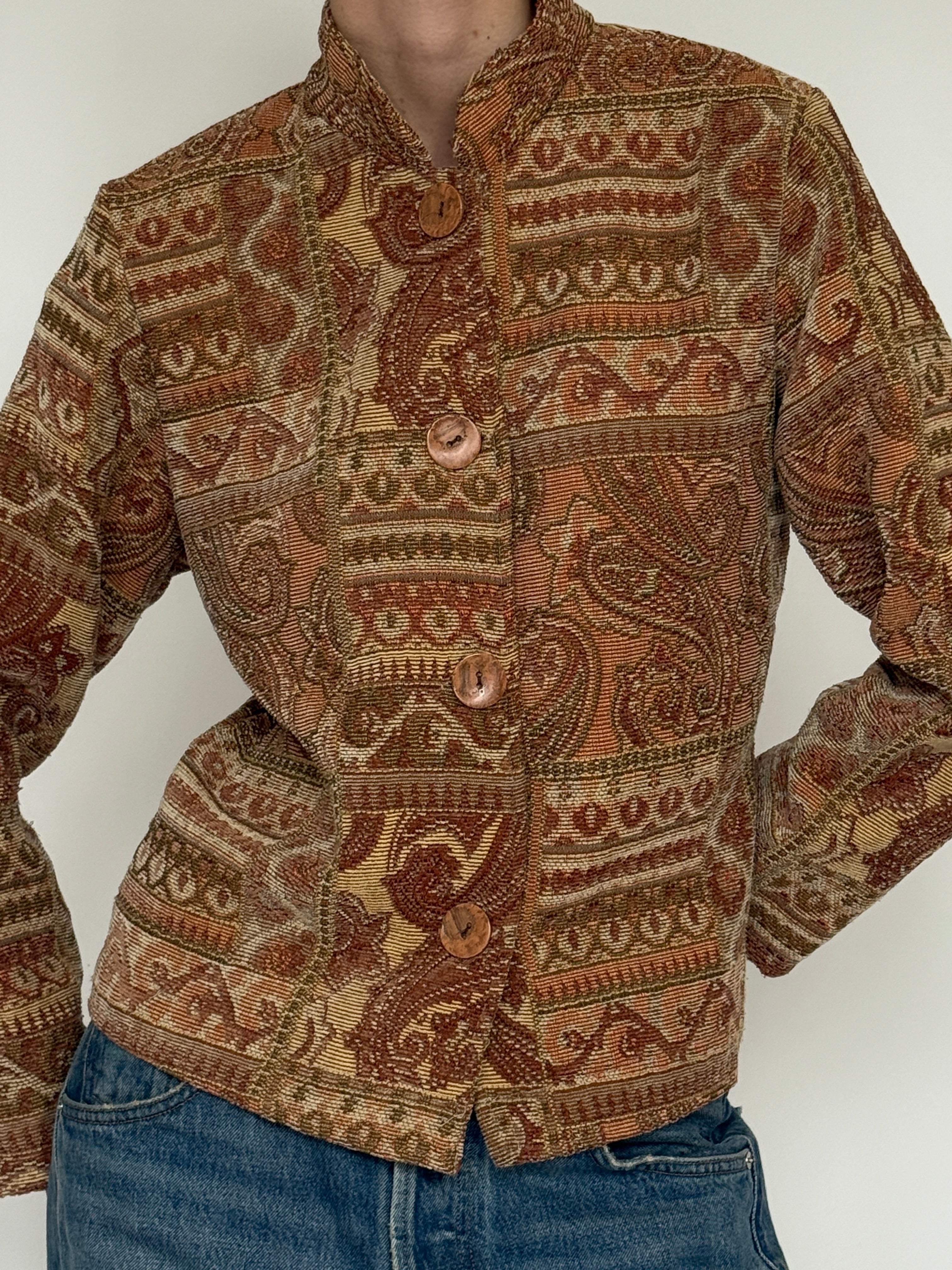 Vintage brown paisley tapestry jacket fabric close-up