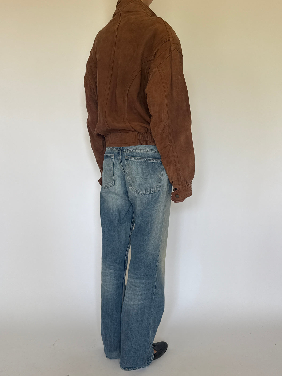 Vintage brown leather bomber jacket back view