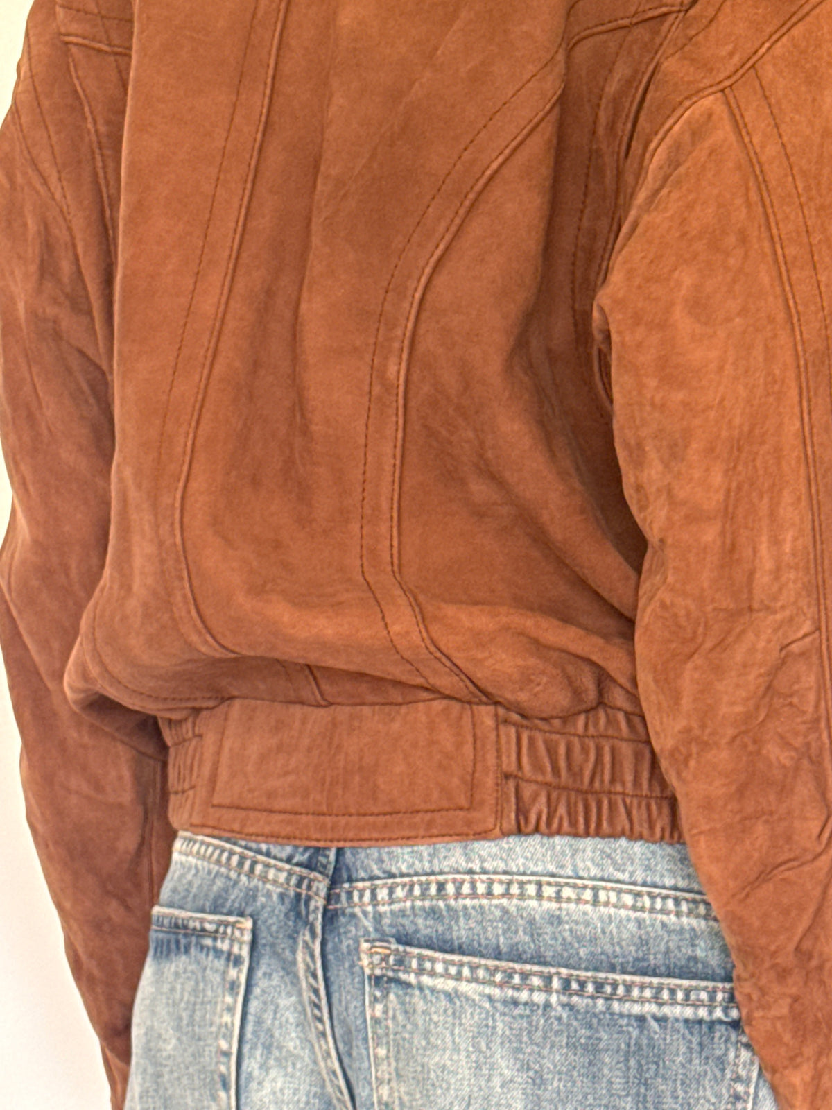 Vintage brown leather bomber jacket back view
