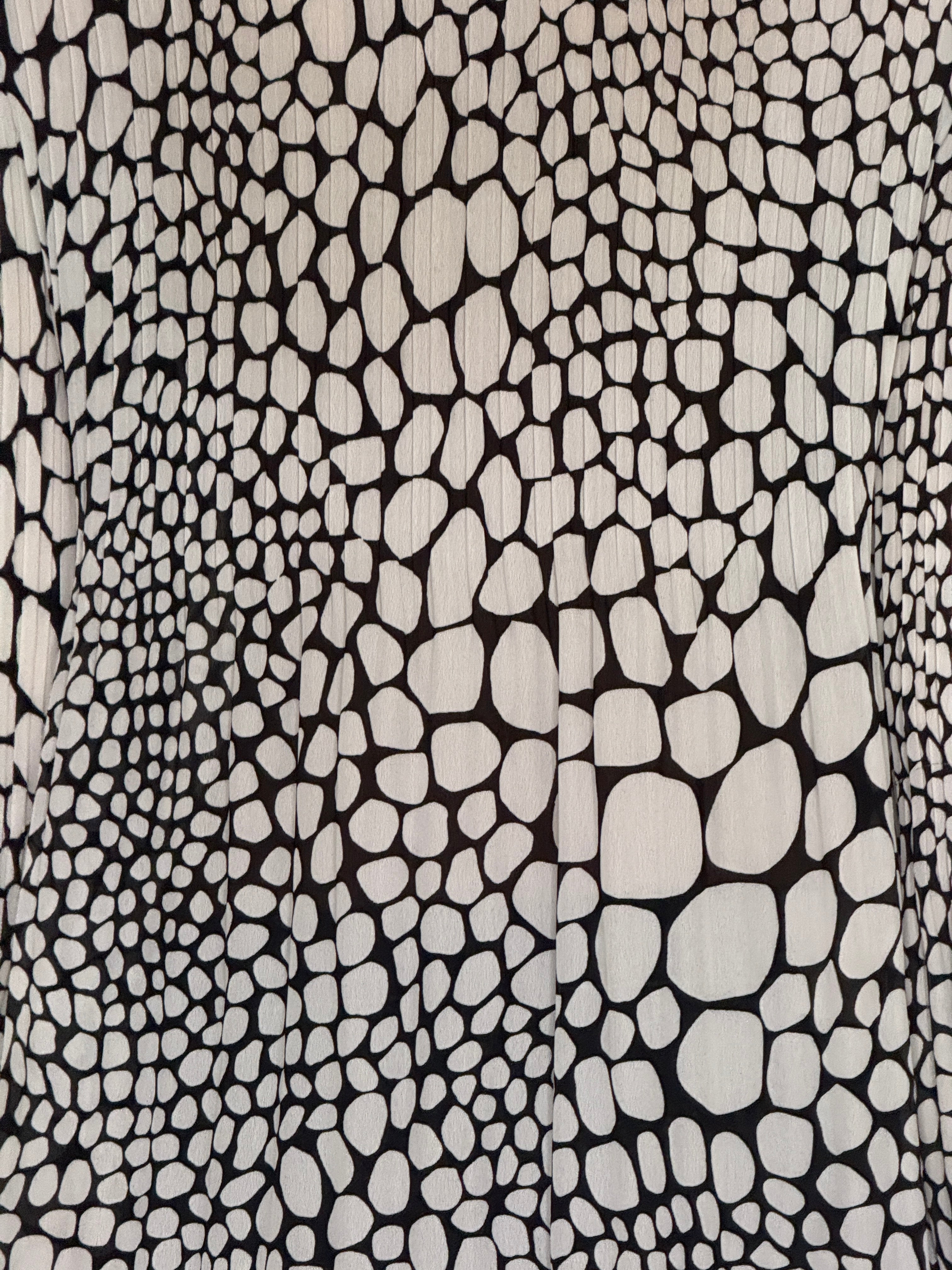 Vintage black and ivory pebble print blouse fabric close-up