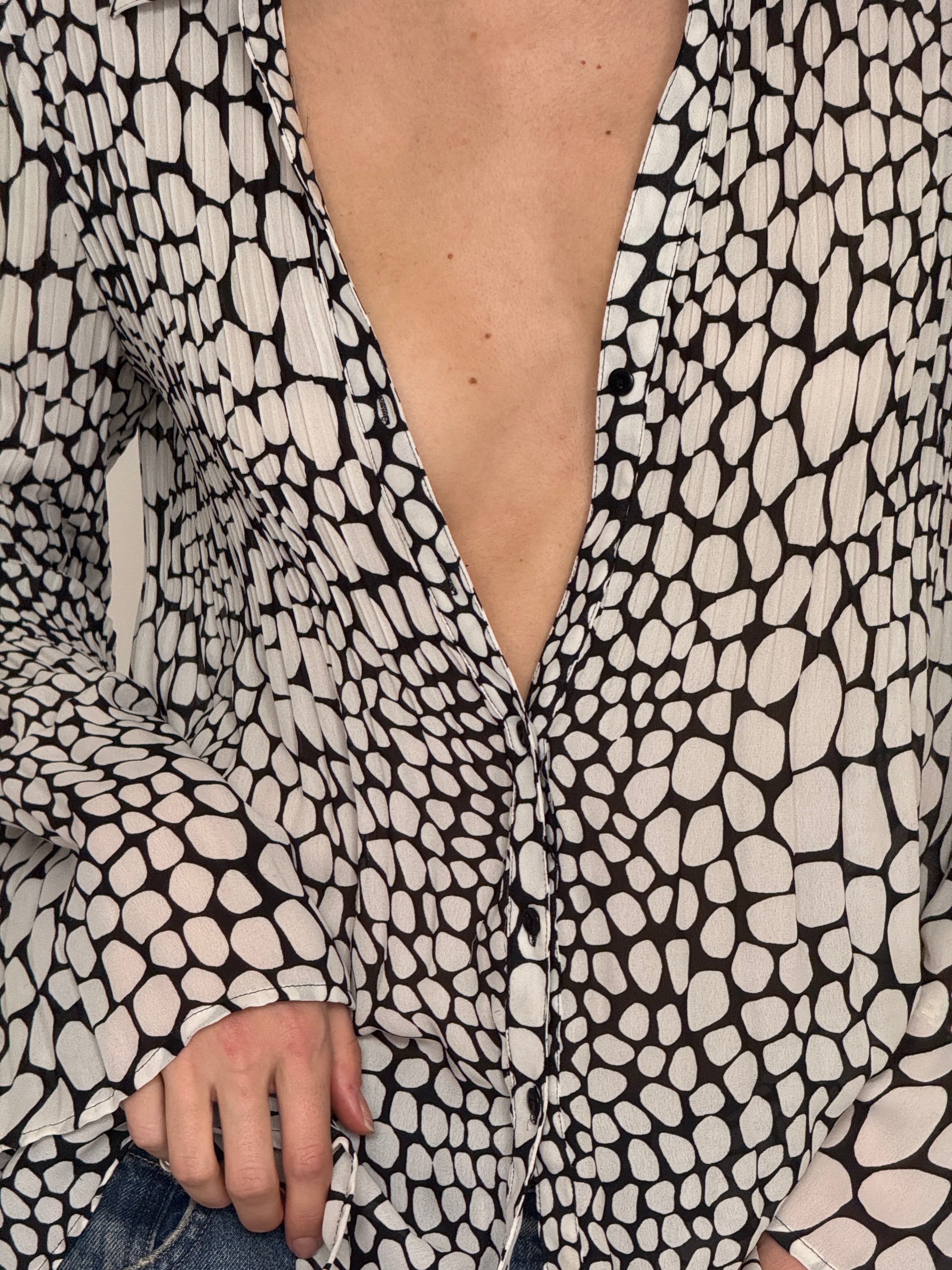 Vintage black and ivory pebble print blouse fabric close-up