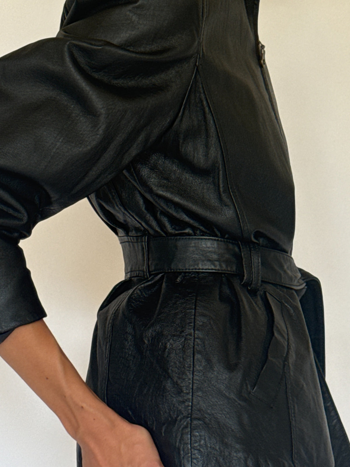 Vintage belted leather jacket black leather close-up