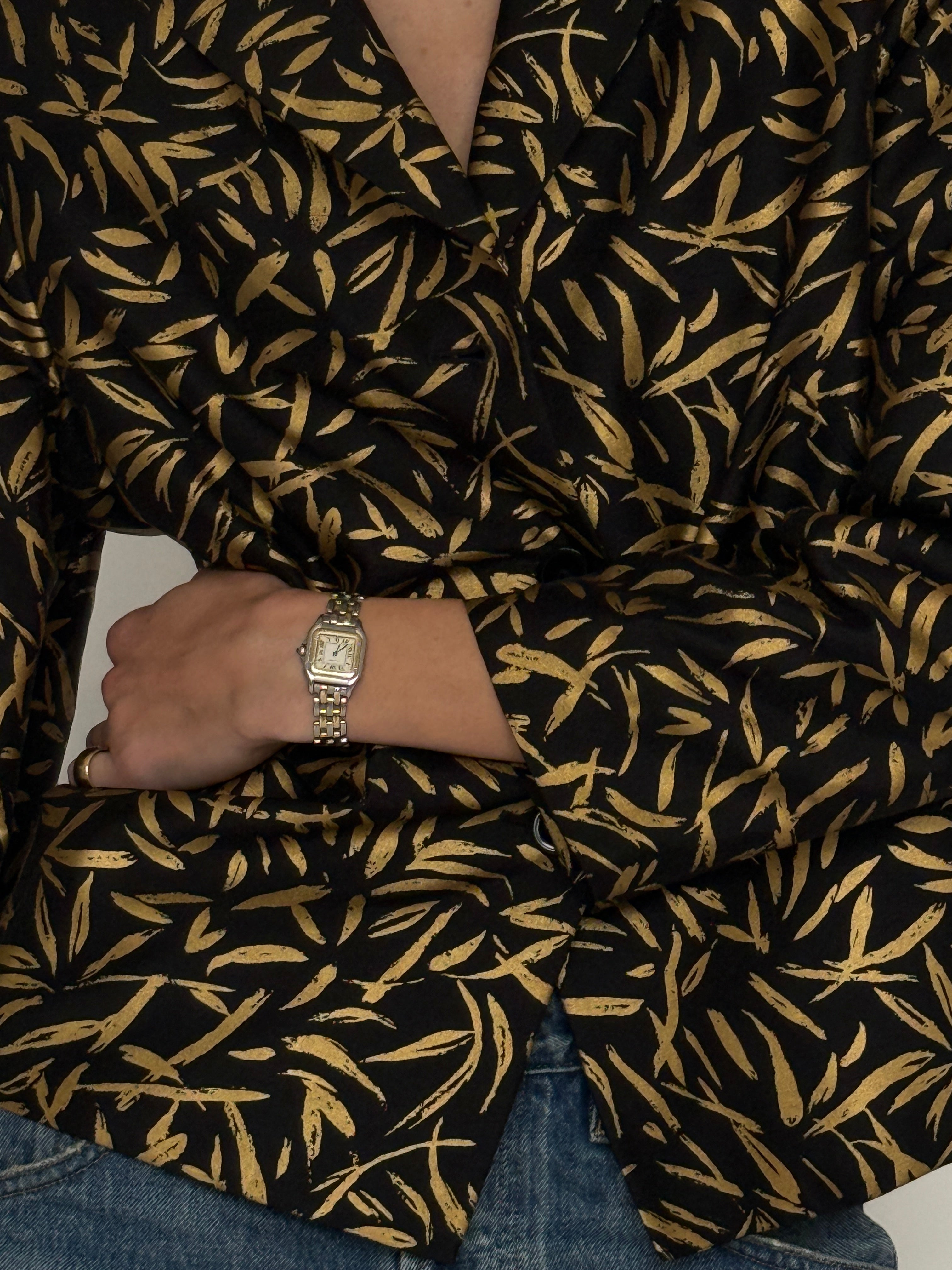 Vintage black gold jacquard blazer fabric close-up