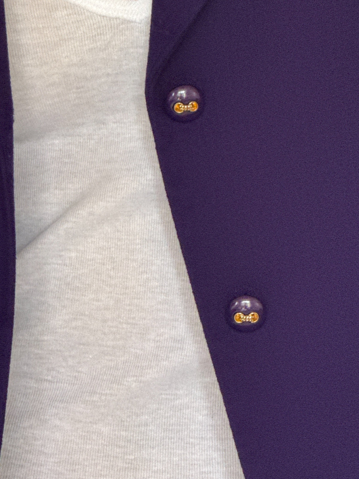 Vintage purple blazer decorative button close-up