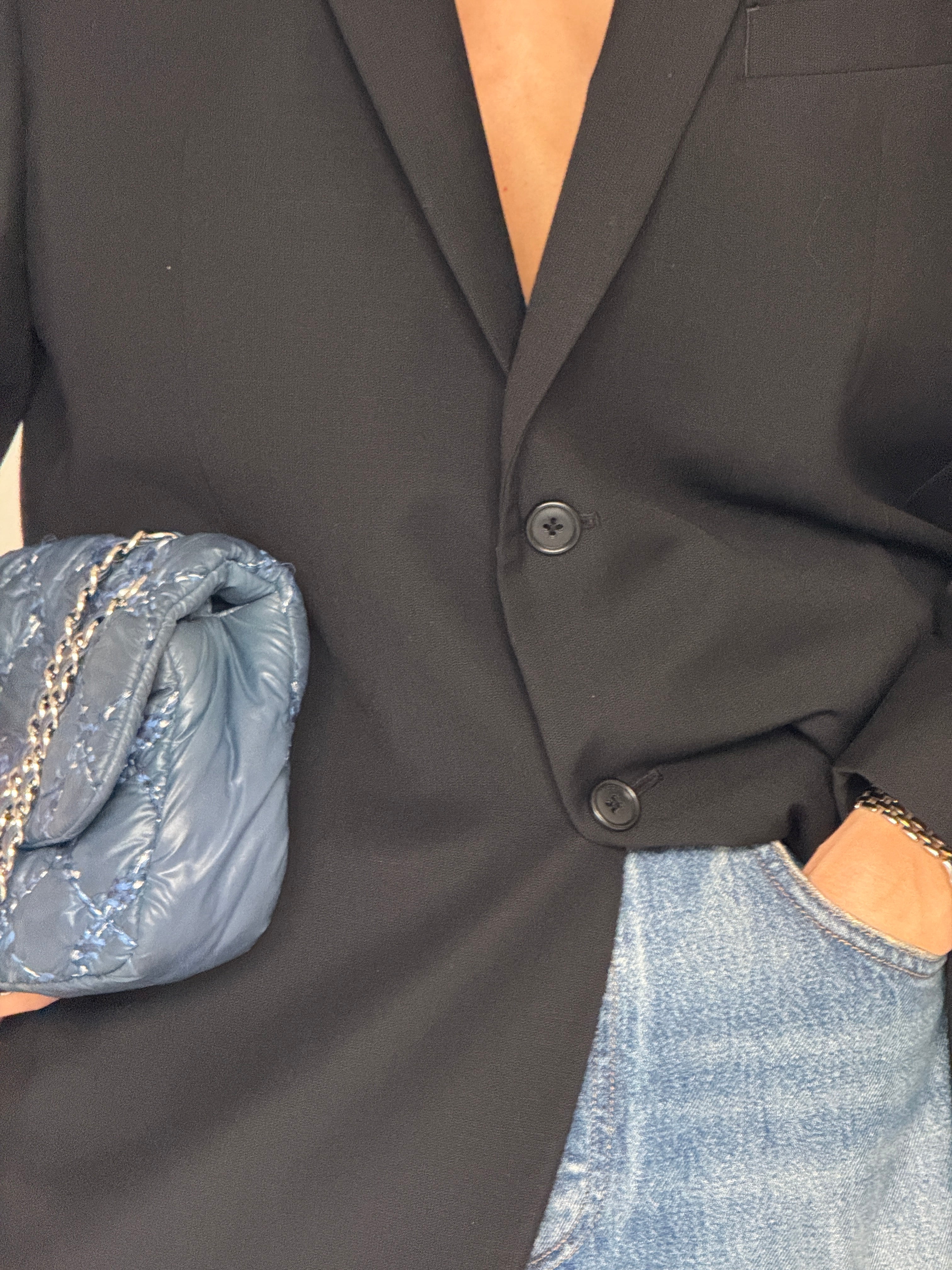 Vintage black oversized blazer fabric close-up