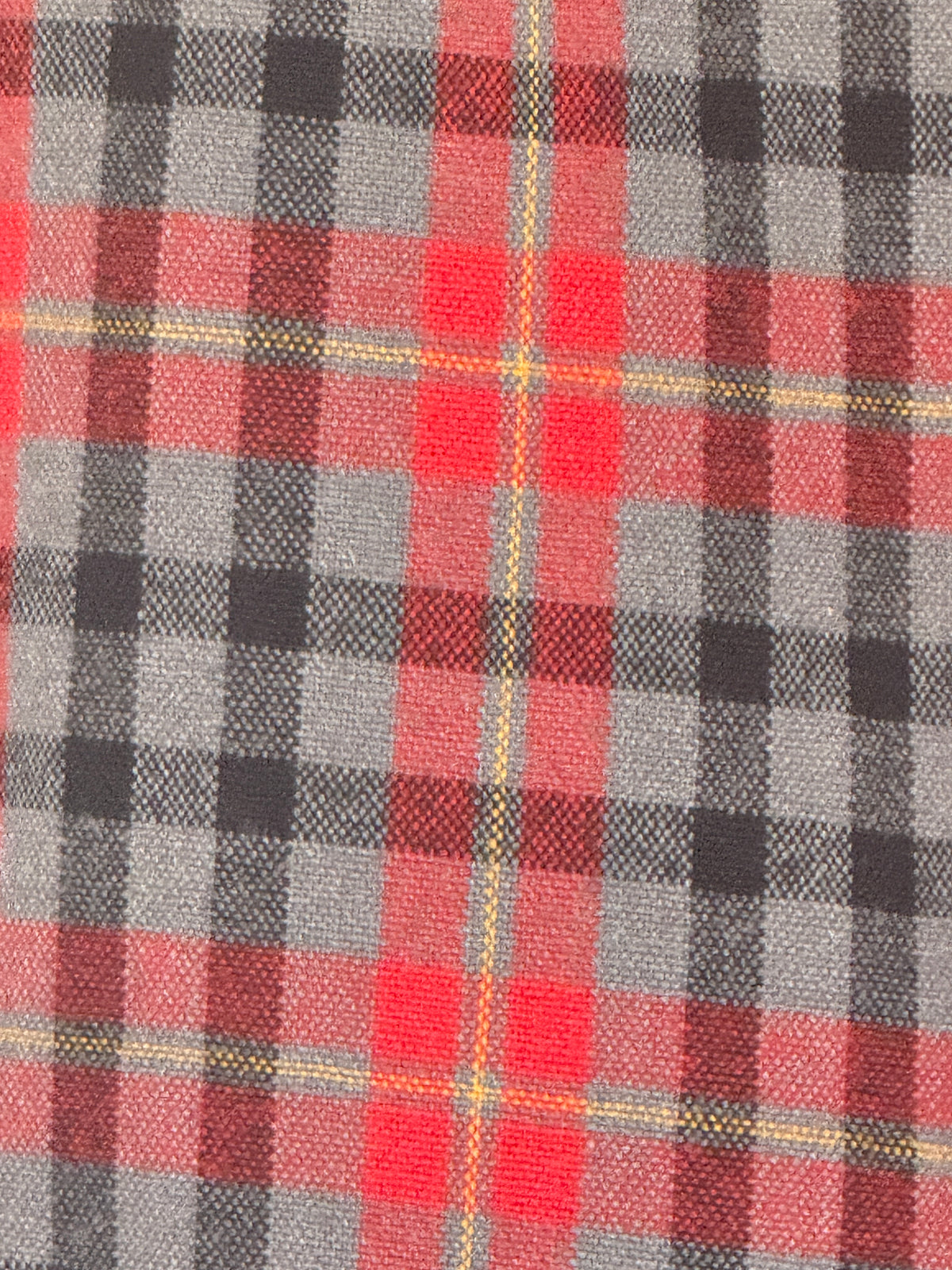 Vintage red charcoal plaid flannel fabric close-up