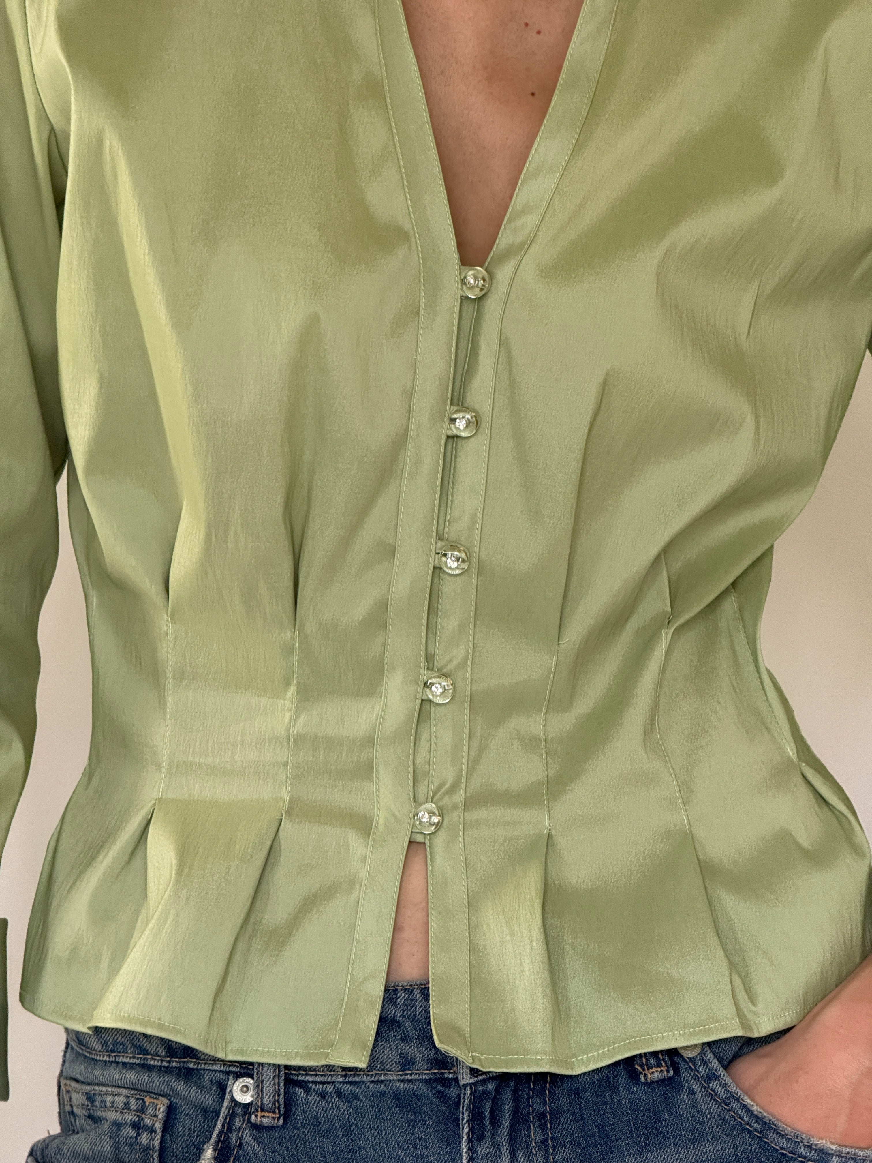 Vintage sage green satin blouse close-up of pearl-look button detail