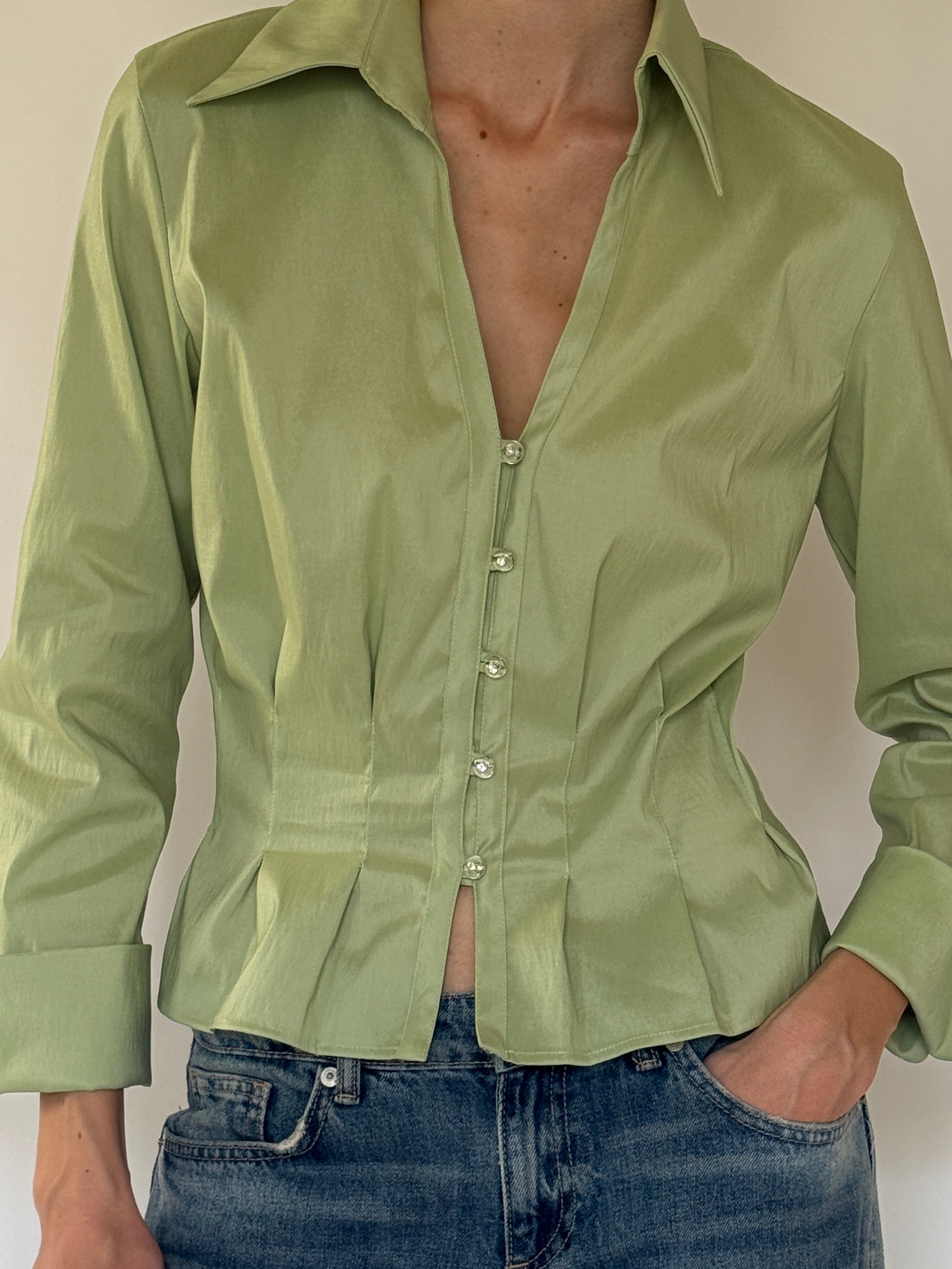 Vintage sage green satin blouse close-up of pearl-look button detail