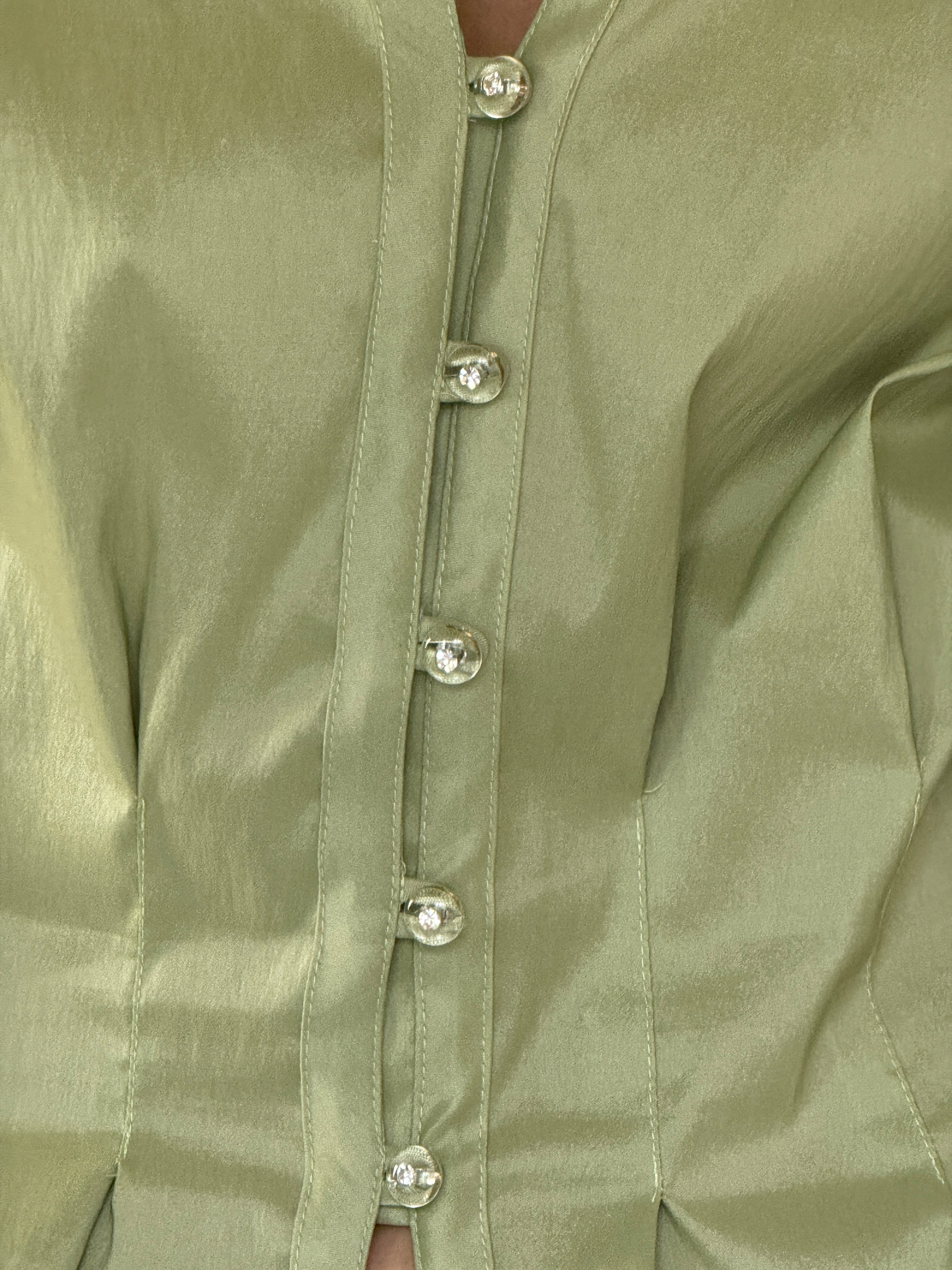 Vintage sage green satin blouse close-up of pearl-look button detail