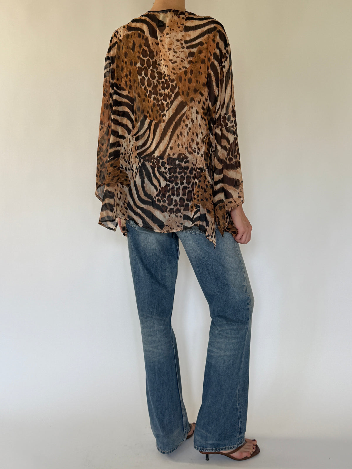 Vintage flowy animal print blouse back view