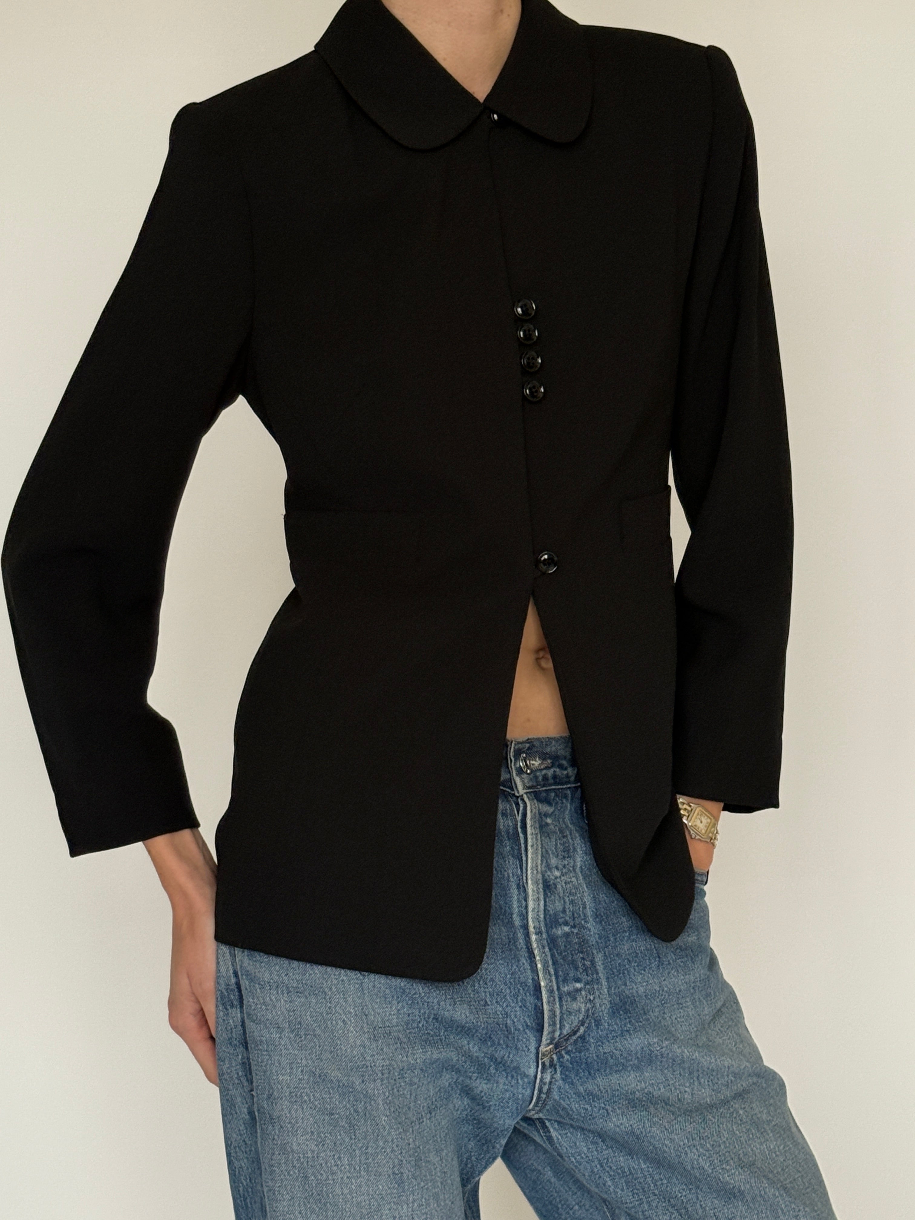 Vintage black blazer button detail close-up